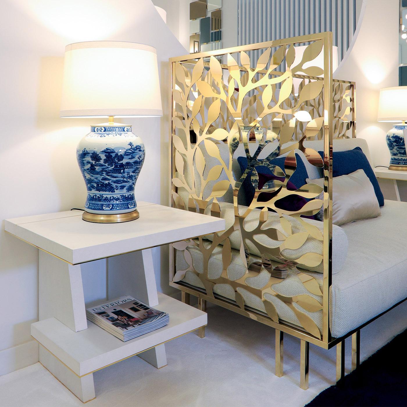 Named after its stylish design, this side table features a ladder-like shape that makes it versatile and ergonomic. Handmade of white maple wood, it is enriched with a stunning profile in 24K gold-plated brass. Please refer to the Concierge for