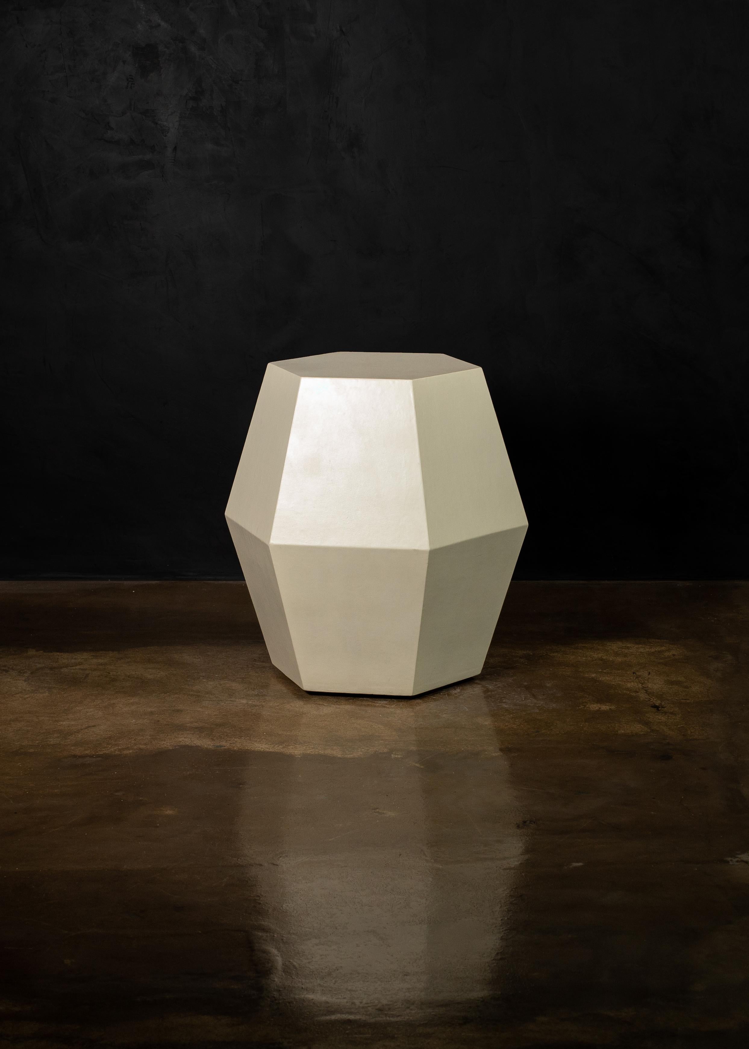 The name of the Tamino Hex comes from its hexagonal shape and can be specified in any of Costantini’s available materials and finishes. Shown here in crema laquer, these side tables feature a modern, geometric shape that allows the subtle variations