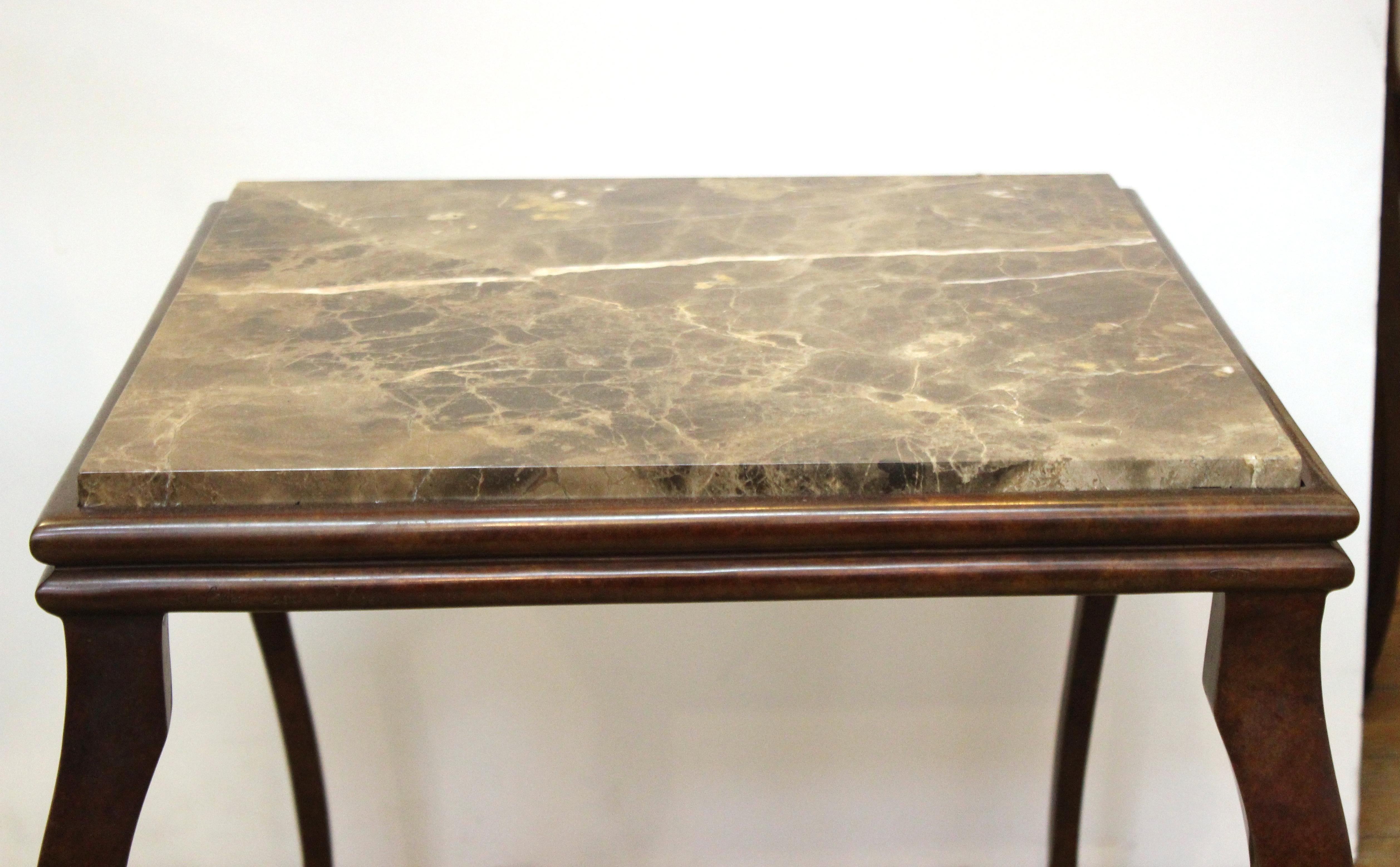Modern side table with bronze structure and cabriole legs and a square marble top. The piece is in great vintage condition with age-appropriate wear.