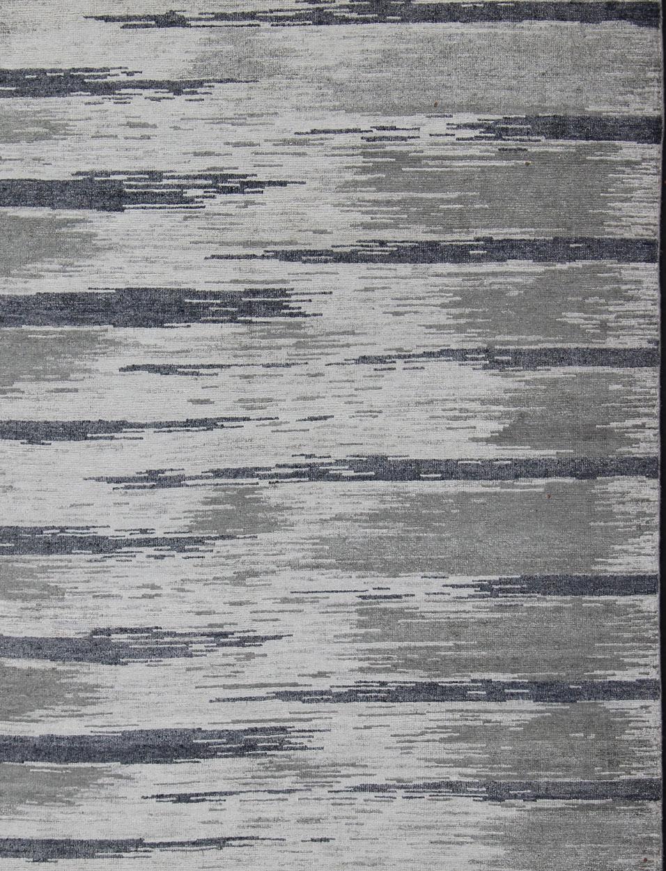 Keivan Woven Arts-This exquisitely hand woven Modern silk rug from India portrays a striped pattern, rendered in shades of blue gray, steel blue, gray, and charcoal, making it a fine choice for variety of modern, transitional and classic