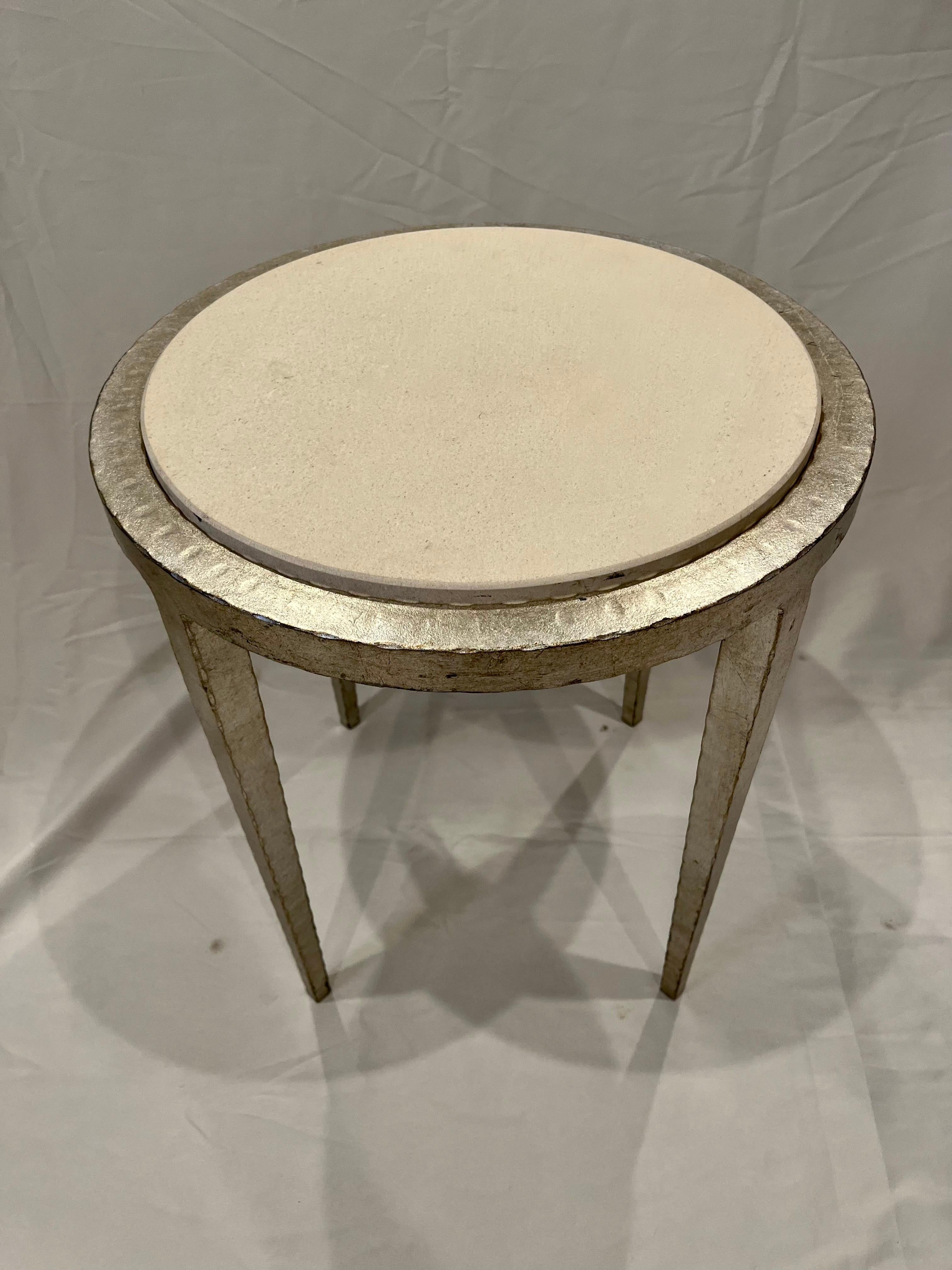 Stunning silver leaf iron table with stone top. Modern classic lines with etched or hammered hepplewhite legs. Beautiful complimenting white stone top framed in same.
Curbside to NYC/Philly $300