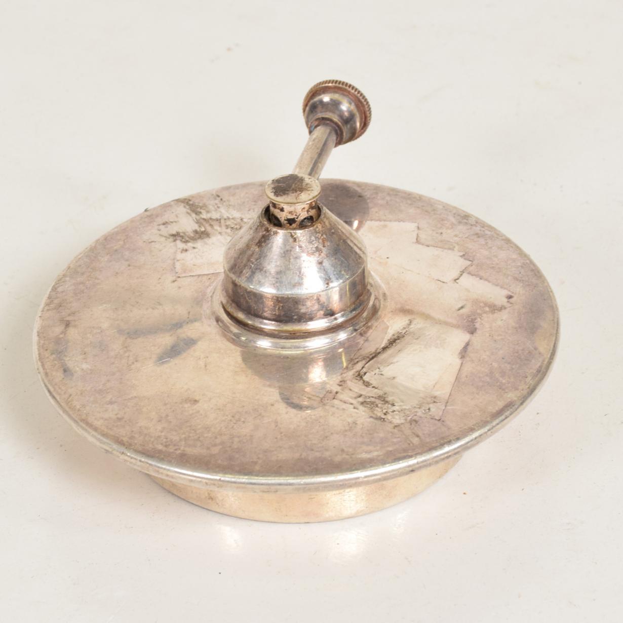 For your consideration, a modern silver plated chafing dish burner.

No information on the maker. 

Dimensions: 4 3/4