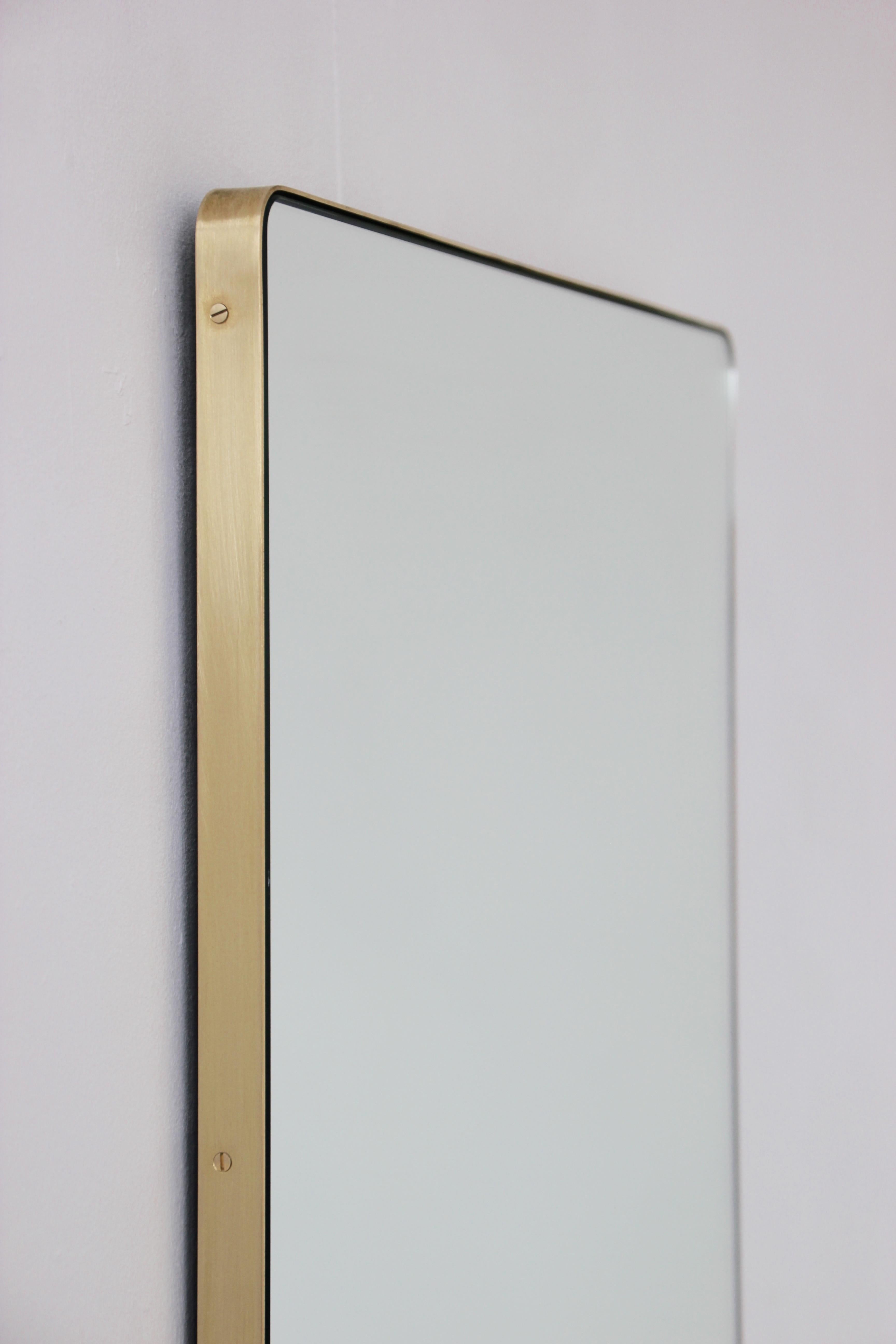 Elegant rectangular mirror with a slim brass frame. The detailing and finish, including visible brass screws, emphasise the craft and quality feel of the mirror, a true signature of our brand.

Supplied fully fitted with a specialist hanging system