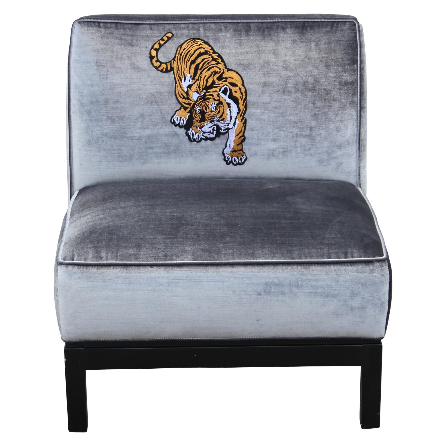 Pair of lovely clean lined slipper chairs with deep walnut bases and freshly upholstered in a lush silver/grey velvet with custom tiger motif embroidery.