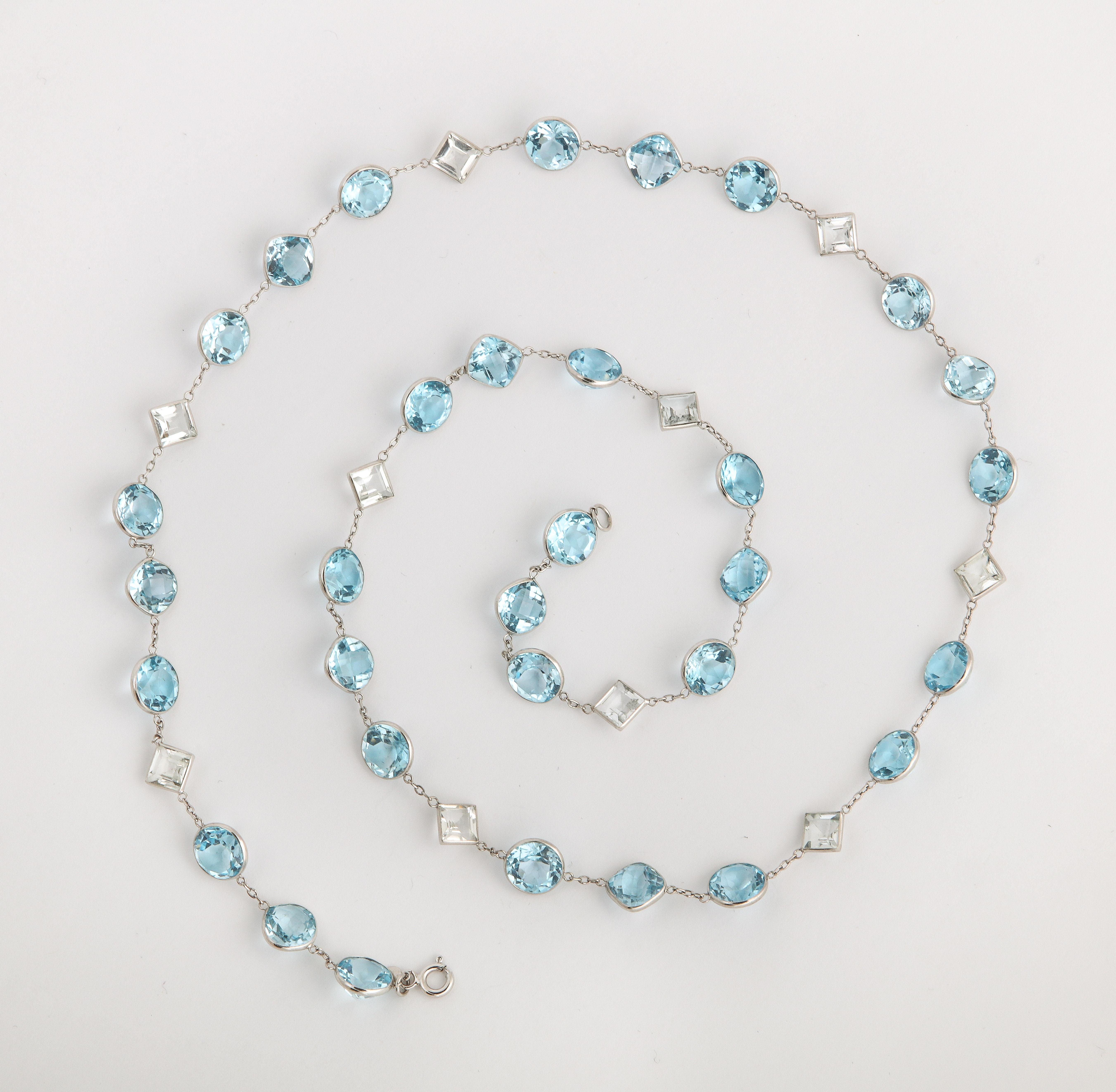 The beautiful soft blue and white crystal chain made in the late 1980's is timeless in design and appeal. It is not unlike the long necklaces of the Art Deco era nor different from the necklaces women buy today. Set in sterling the stones are