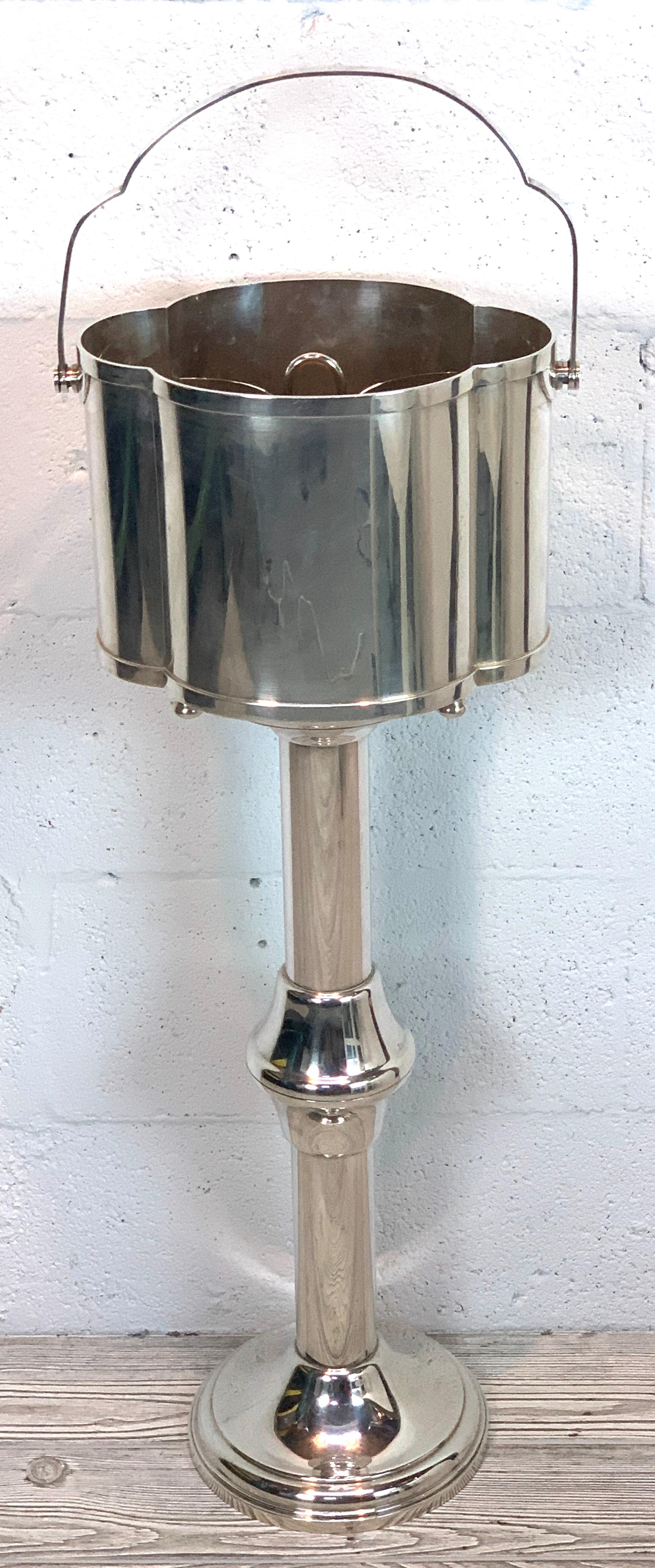 Modern silver plated double champagne bucket and stand, exceptional quality in consisting of three parts oval handled champagne / wine bucket 12.5 W x 9” D x 15 H interior measures 10.75 x 8.25, complete with bottle caddy, caddy 7” x 5 x 7.5” H,