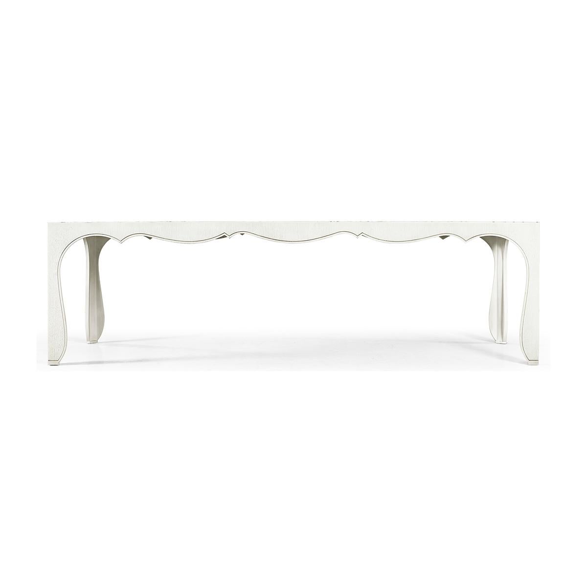 Modern Sinuous dining table, the wood dining table boasts sinuous bracket legs that meet a curvaceous base for a flowing, dramatic profile that delights the eye.

Handcrafted and finished in a luxurious chalk white, Asperitas presents an exclusive