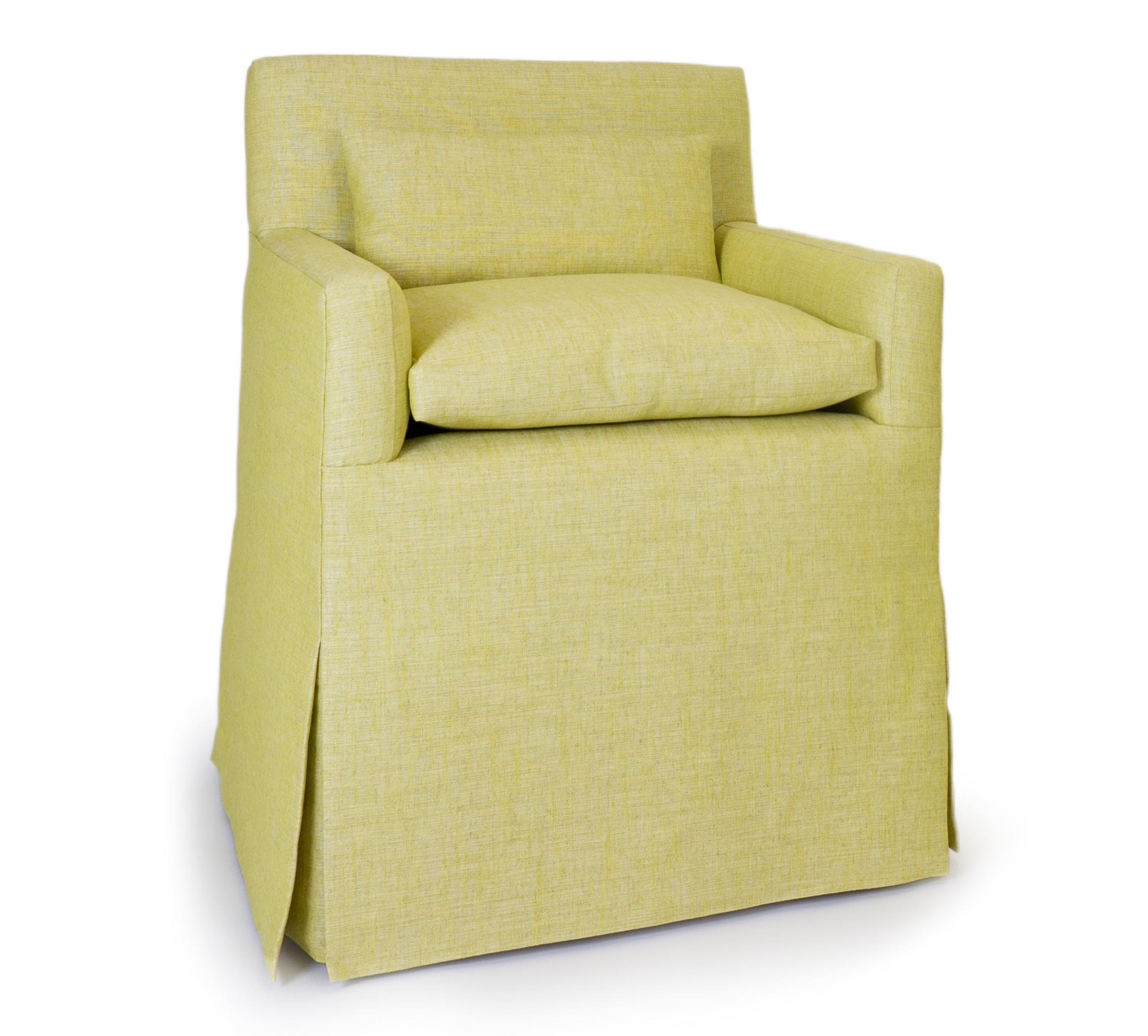 The chairs shown feature a skirt with neat pleated edges, a low back and loose seat cushion. It is upholstered in a yellow/green textured poly linen. The base sits atop casters. This piece is completely customizable by size and finish.