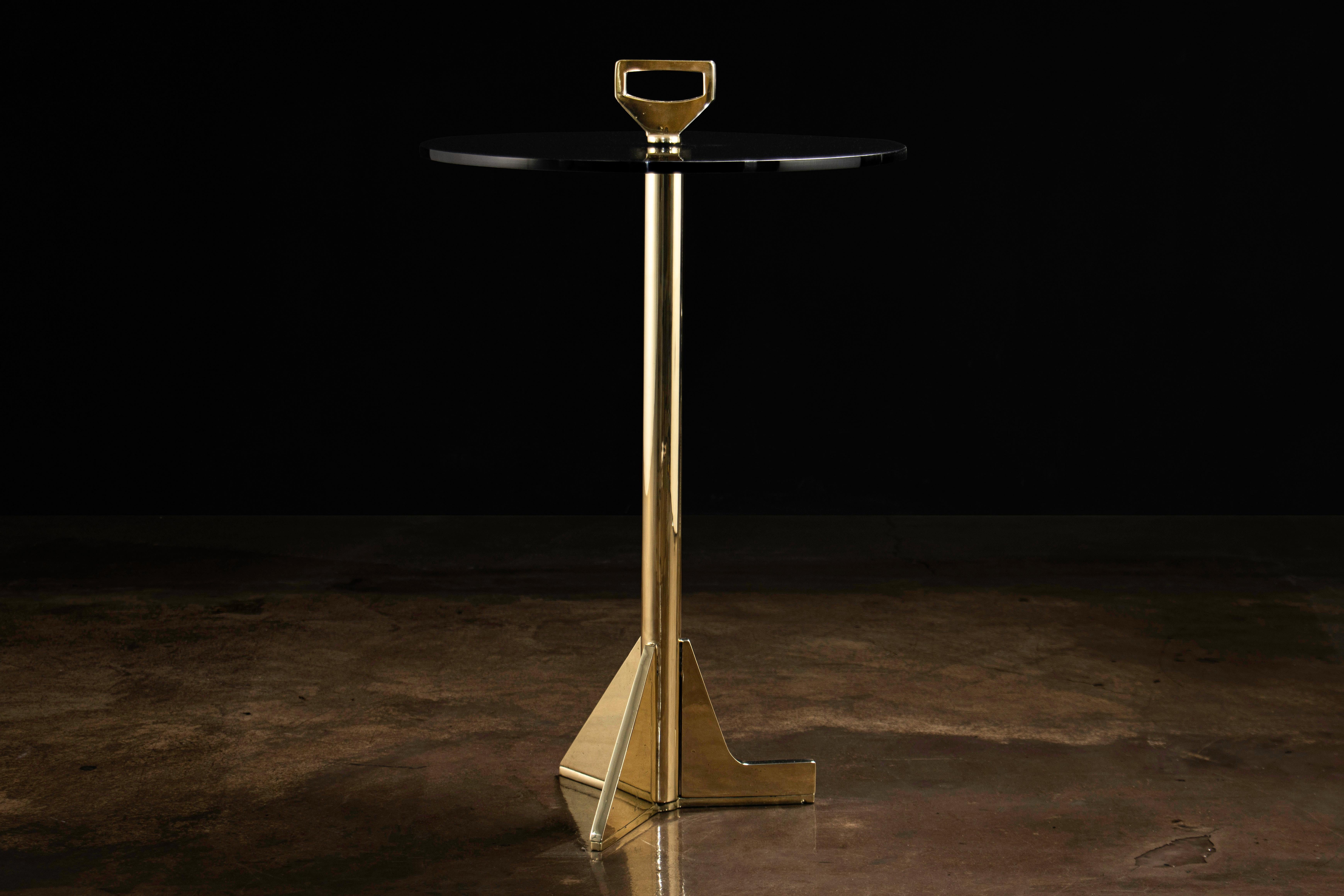 Bellance Modern Glass & Cast Bronze Cocktail Table from Costantini Design 

This playful table made of cast bronze and smoked glass features asymmetrical 