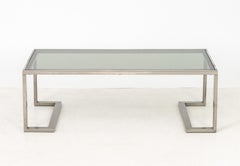 Moderner Couchtisch mit Rauchglasplatte und Metall