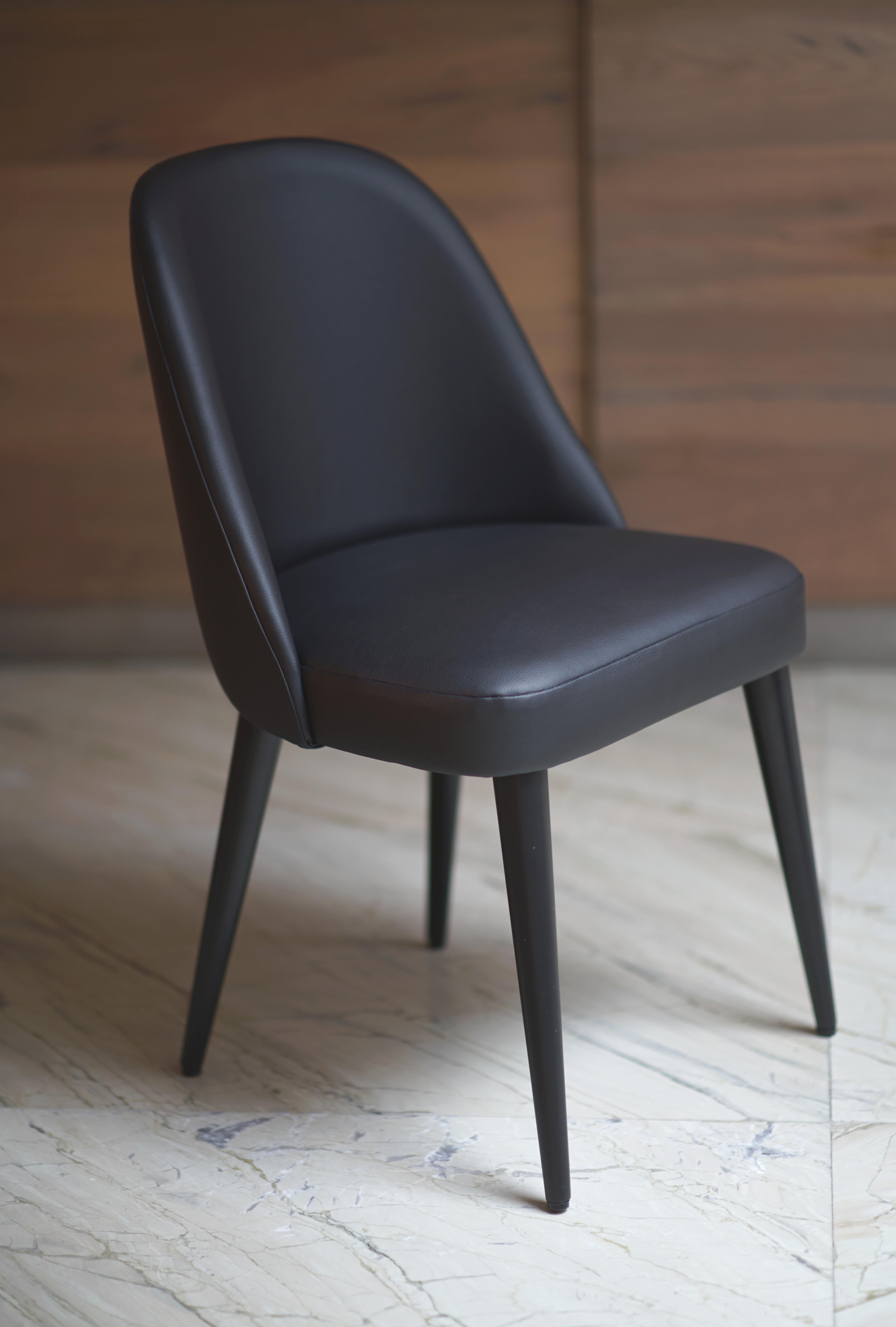 Helsinki collection. Helsinki chair: simple, elegant, comfortable. Available in oak and walnut base or in custom materials, may be upholstered with variety of fabrics and colors. Natural leather and Vegan Leather option available. Also available as