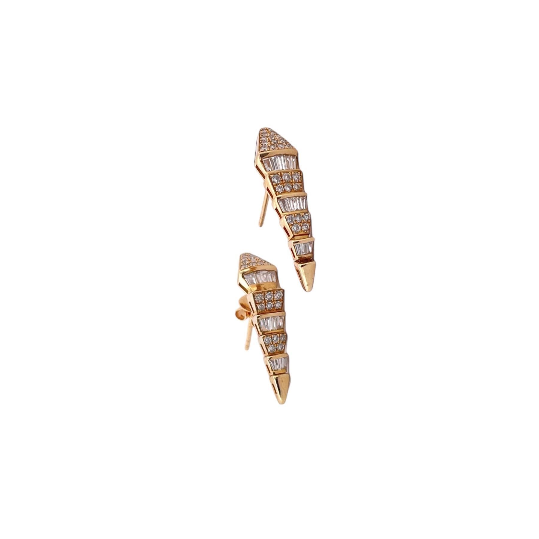 Unleash your inner enchantress with our Elegant Snake Diamond Earrings, a captivating blend of sophistication and allure. These exquisite earrings feature a sinuous snake design adorned with a total of 50 round diamonds in the body and 23 tapered