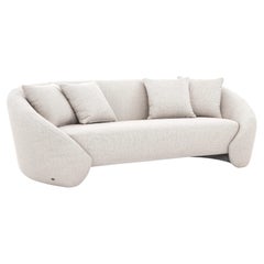 Sofá de 4 plazas personalizable con tela y cojines gris claro, diseño arqueado