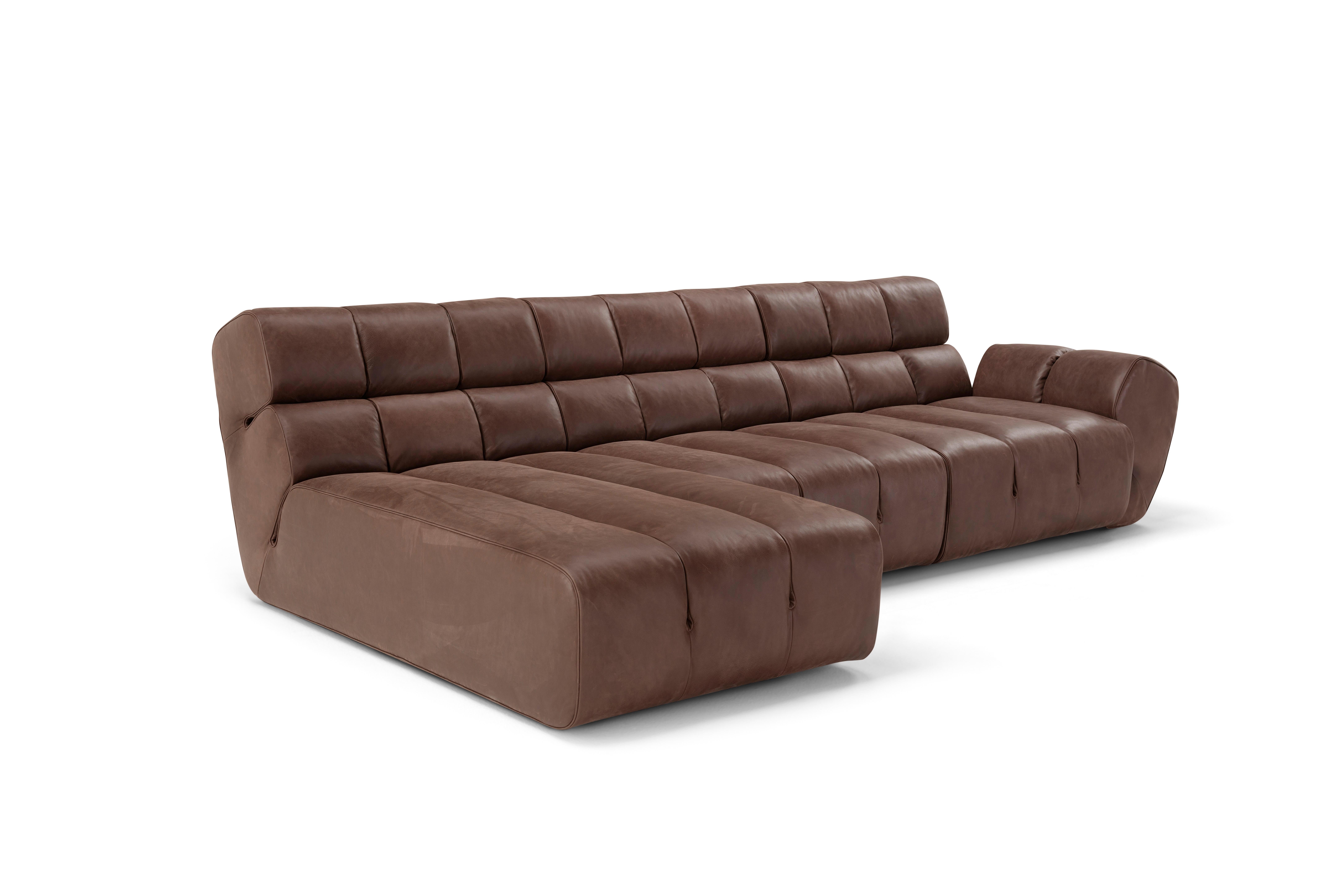 Sectional sofa Palmo by Amura Lab 
Designer: Emanuel Gargano

Model shown: Textile - Leather Old Velvet 2064

Inspired by the natural gesture of an opening hand, Palmo is the new living concept designed by Emanuel Gargano.
The leather folds