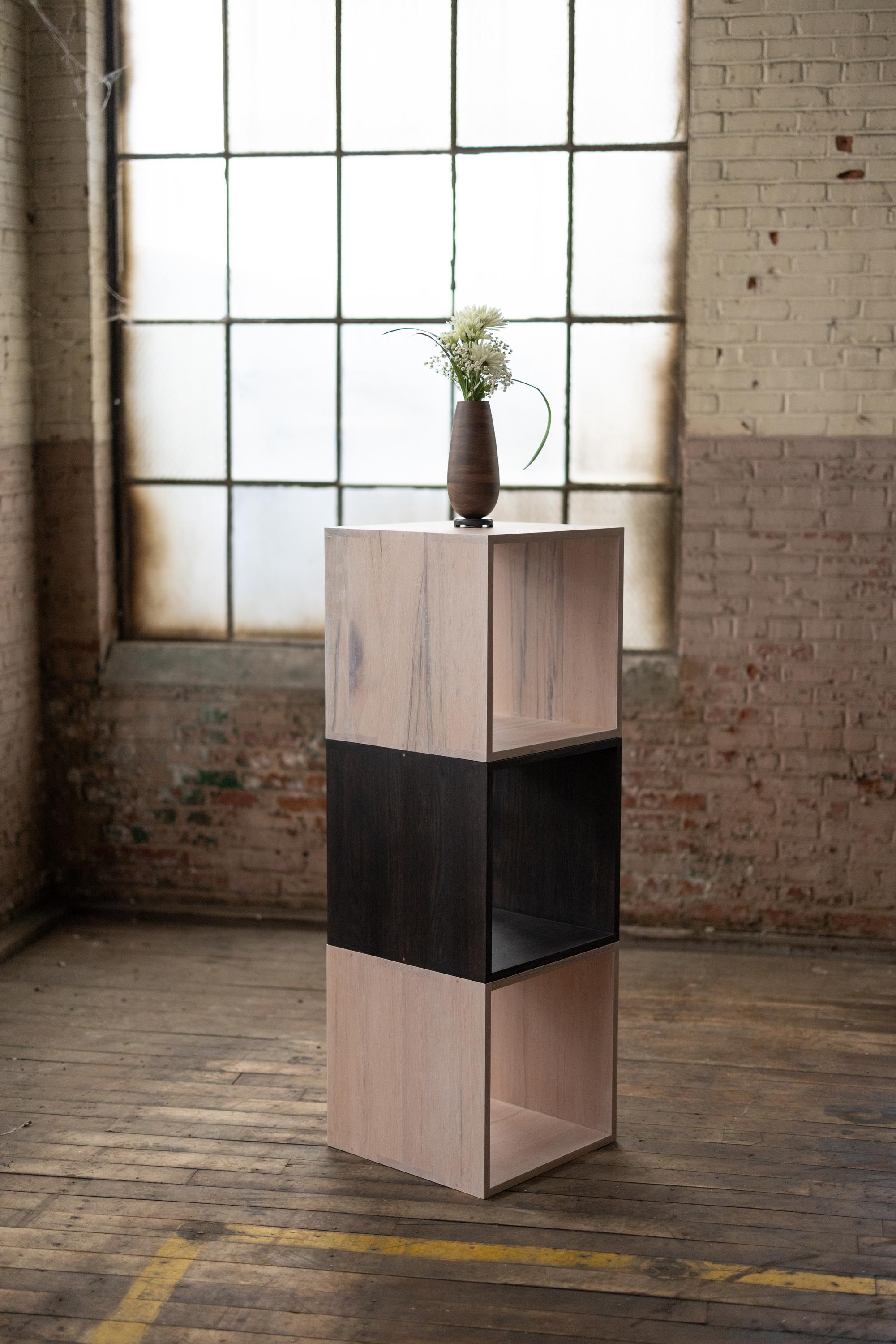 These modern solid oakwood cocktail cubes with bronze details are the right height for a coffee table or cocktail table for drinks and tapas. The interior fits records, books or collections of any kind. Arrange as one, a pair or a foursome for a
