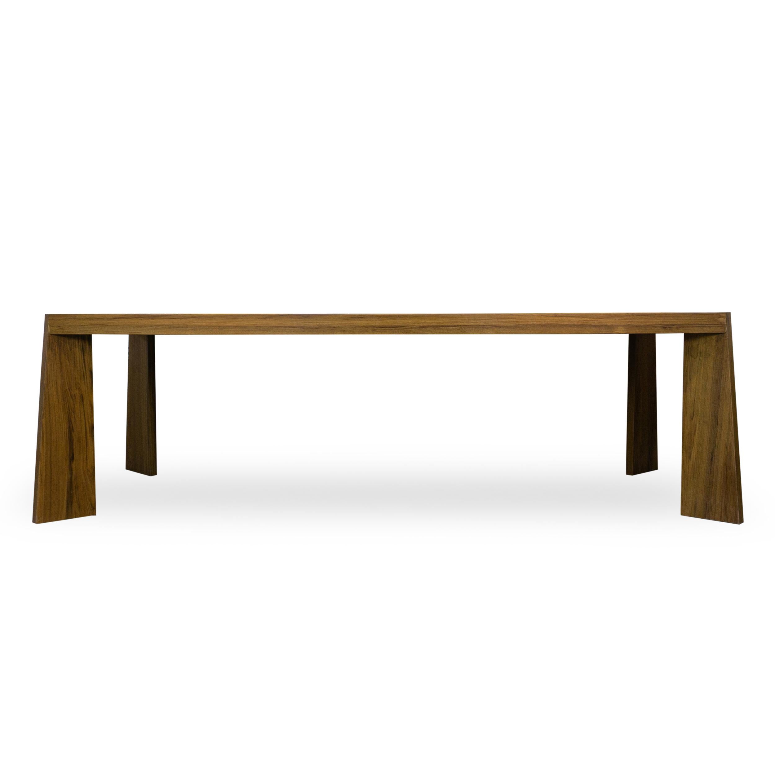 100% solid teak dining table with tapered legs and live edge feature in middle of table. Grain has much contrast including blondes and browns. Designed by Jhon Ortiz and manufactured in Norwalk CT.

Overall: 43”W x 98”D x 30”H

Price As Shown: