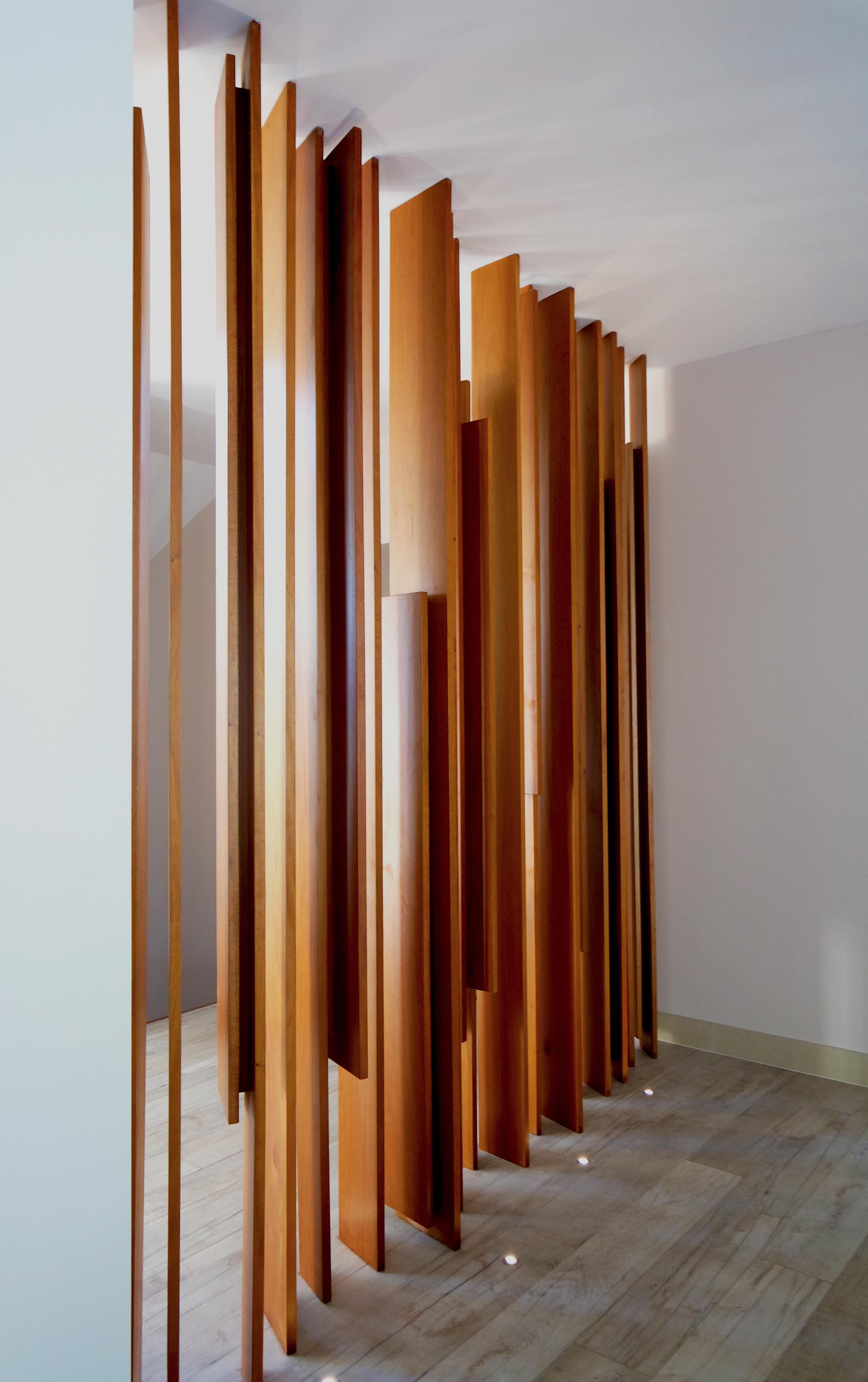 Modern wood sculpture wall screen by Pierre Sarkis from Celine collection. Inspired in the rhythm of ocean waves, beauty of fluid movement and feminine cadenza by basic elements and fine selected woods. Artistic wooden screen, a great option for