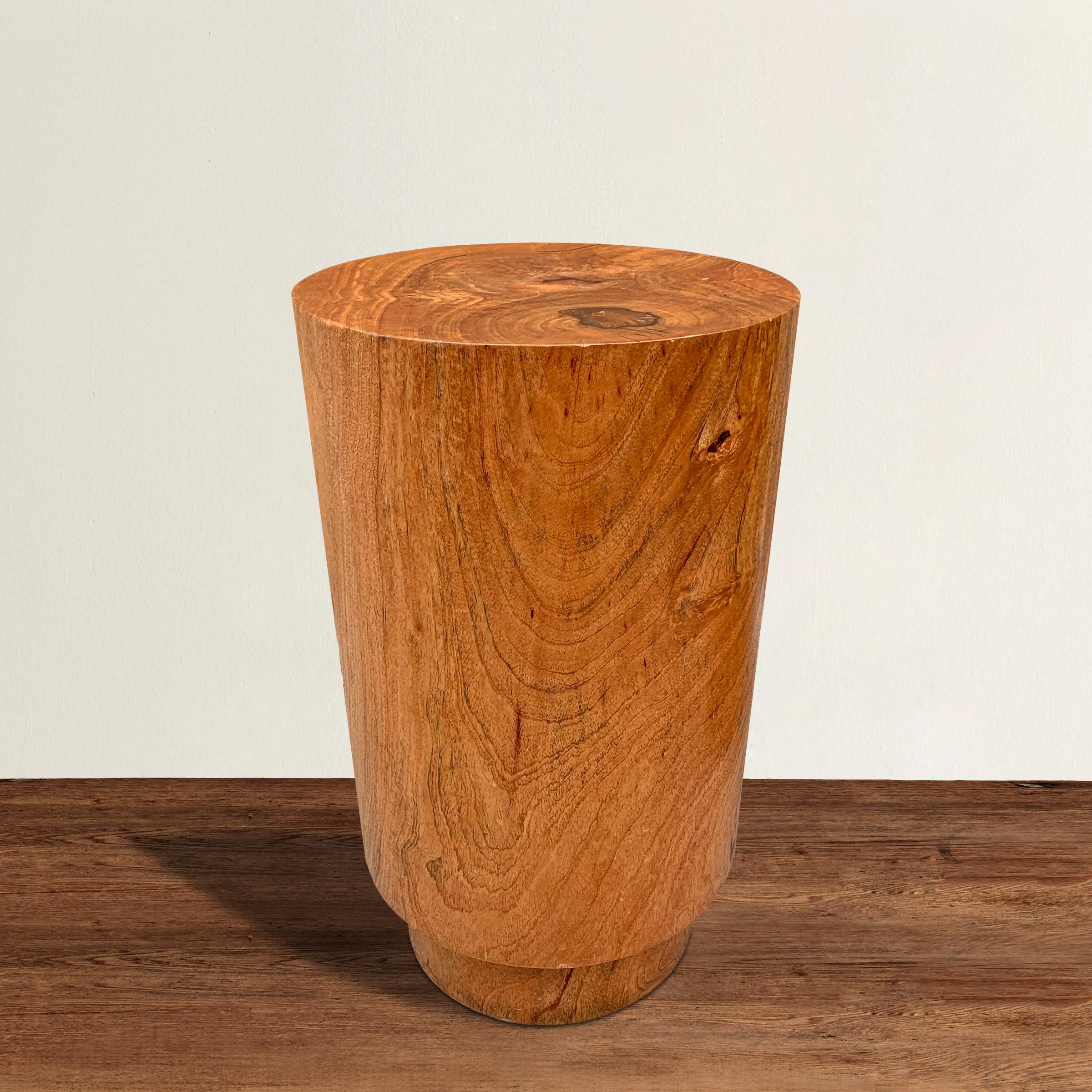 A fantastic modern side table carved of one piece of wood and of cylindrical form with a stepped-back foot. Perfect as a drink's table, side table, or pedestal to show off an objet d'art.