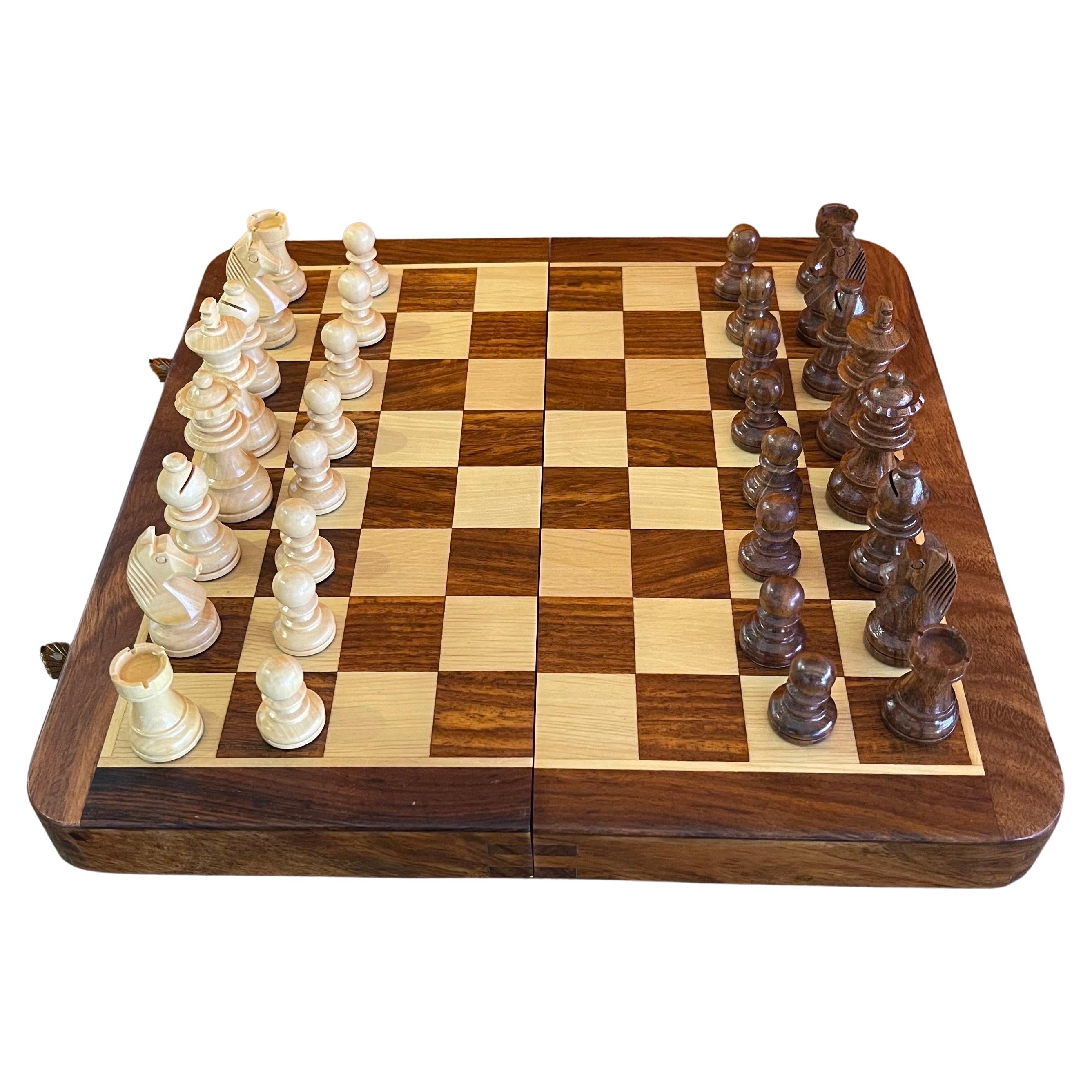 A really nice vintage, high quality solid wood chess set made in Treviso, Italy by Dal Negro, circa 1980s. The set is a portable travel set; the board can be folded in half with the pieces stored inside. Each piece is magnetized and stays put when