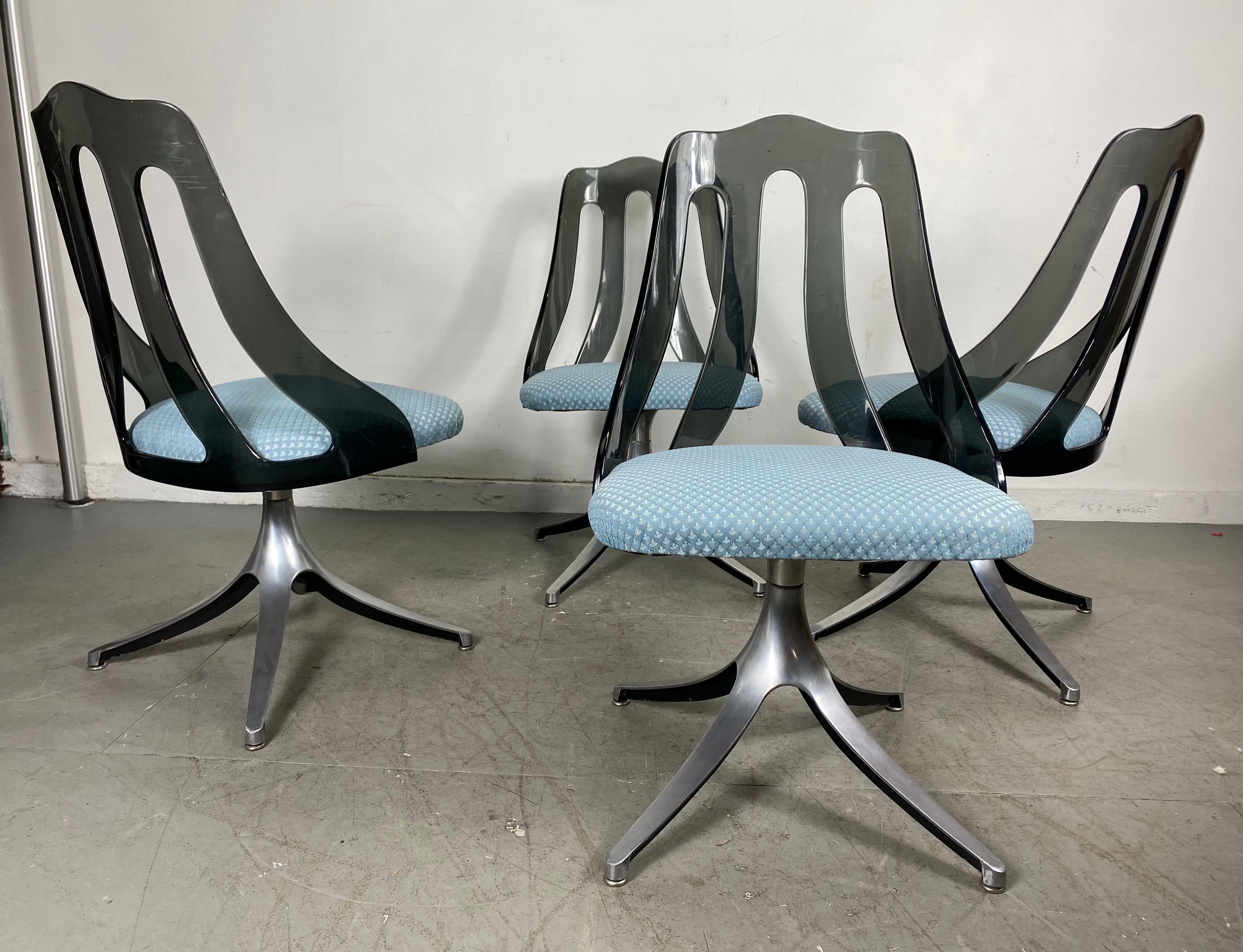 Modern Space Age smoke Lucite and chrome dining chairs by Howell / Interlake, nice set of 4 matching swivel chairs, modernist space age design, smoked Lucite / Acrylic tops in wonderful original condition, seats have been reupholstered, (prob in the
