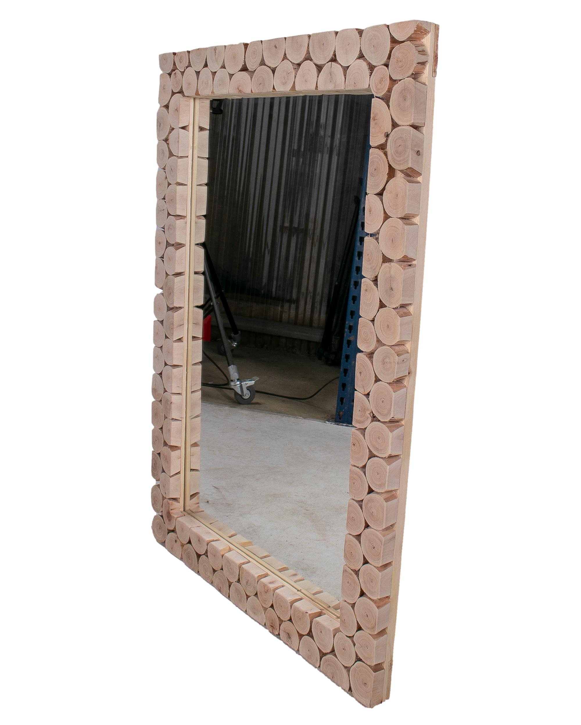 Modern Spanish rectangular mirror with hand made tree trunk mosaic frame.