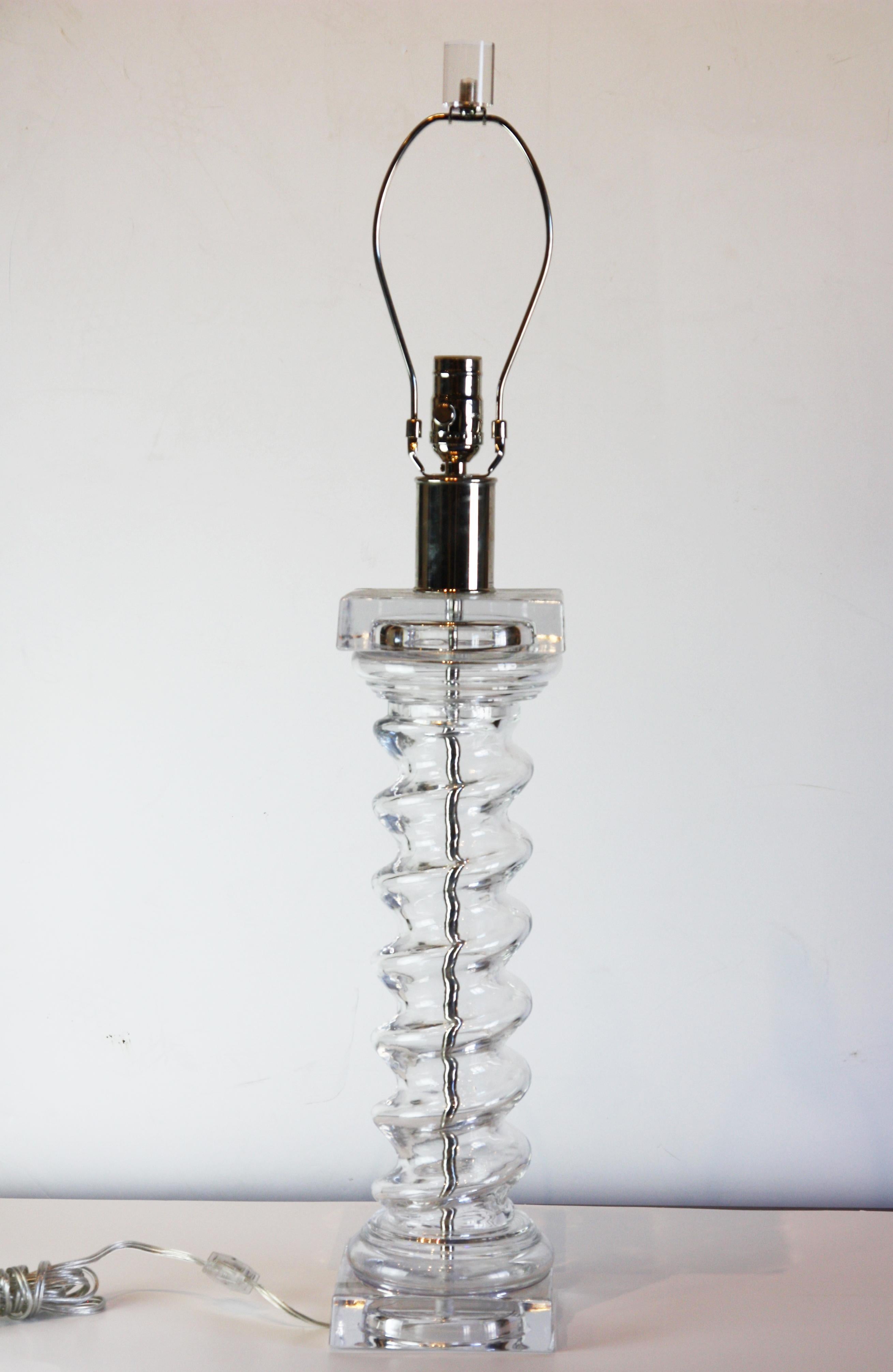 A modern, spiral lamp in Lucite and silver. Lucite finial and shade included (Diameter: 16