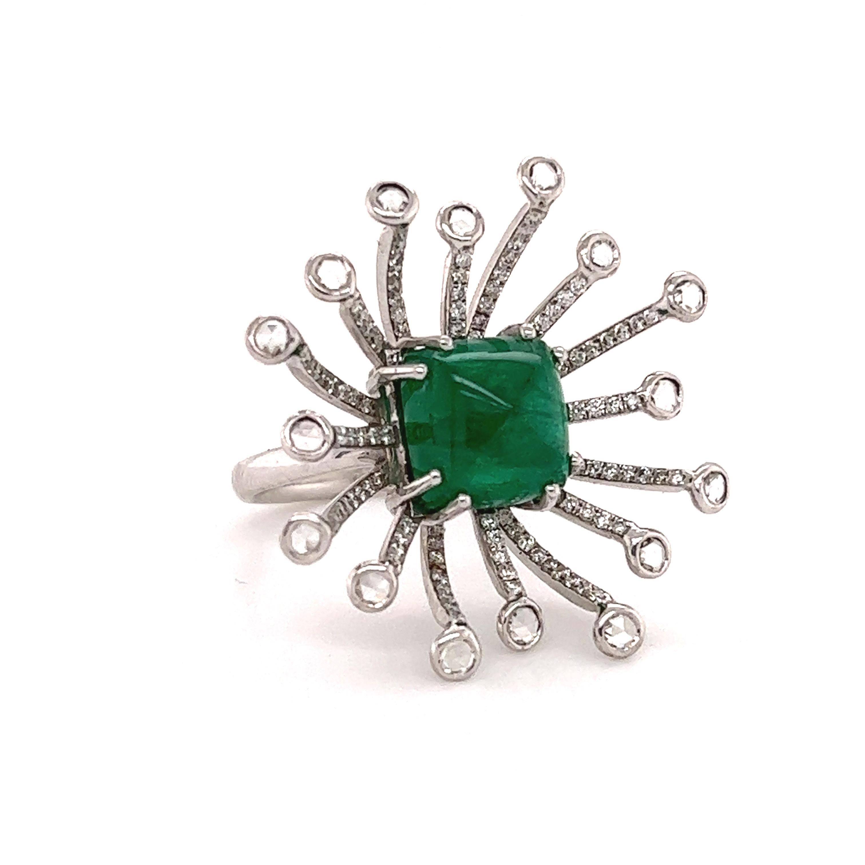 Fantastic design seen on this 18k white gold ring. This exceptional ring shows a modern design with vintage touches. Truly made by master craftsman. The ring showcases a center sugarloaf cut vibrant green emerald gemstone weighing approximately 4.50