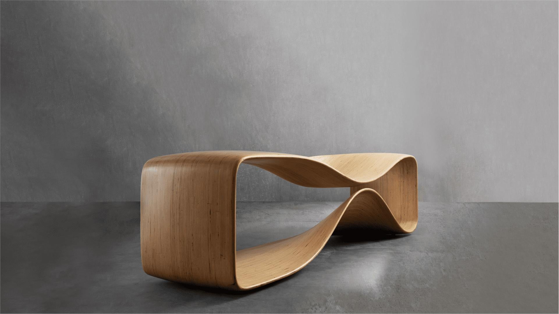 The Loop Bench, made of birch plywood, is the embodiment of elegance and structural strength expressed in captivating curves. Its minimal design allows the bench to integrate into any space, creating a modern and dynamic environment. The water-based