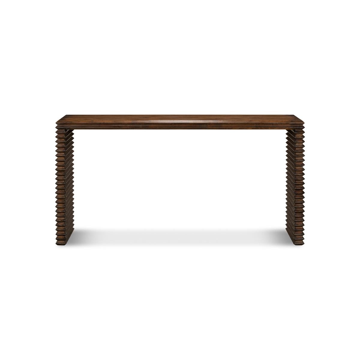 Modern stacked pine console table, made with reclaimed pine in a French brown eclectic stained finish. A simple silhouette wrapped in geometric form with a nod to historical Brutalist design.

Dimensions: 63
