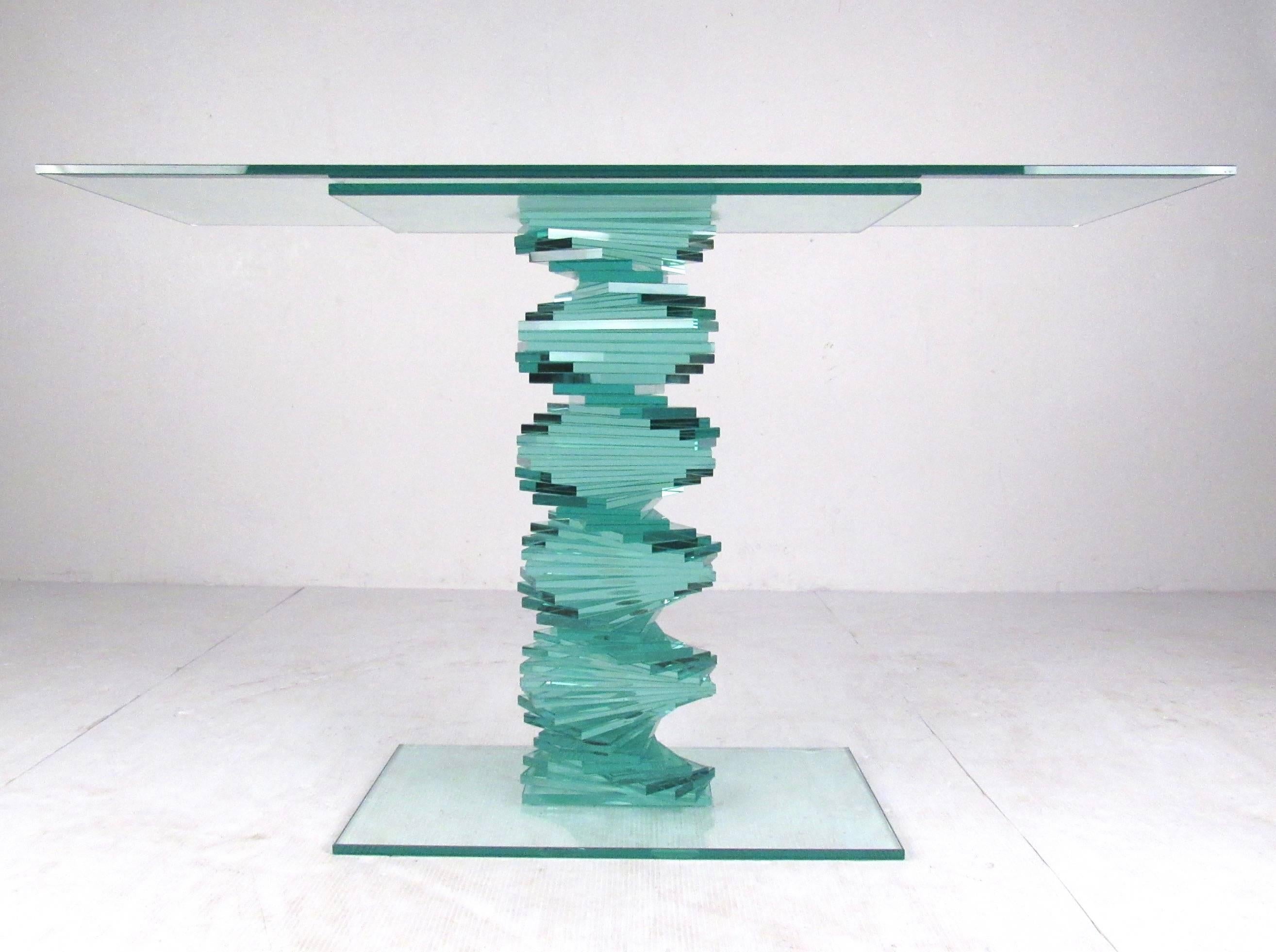 This stacked spiral glass console table features exquisite sculptural modern design. A striking glass console table for entryway, hall display, or office display. Beveled glass top adds to the decorator style of this simple yet stylish contemporary