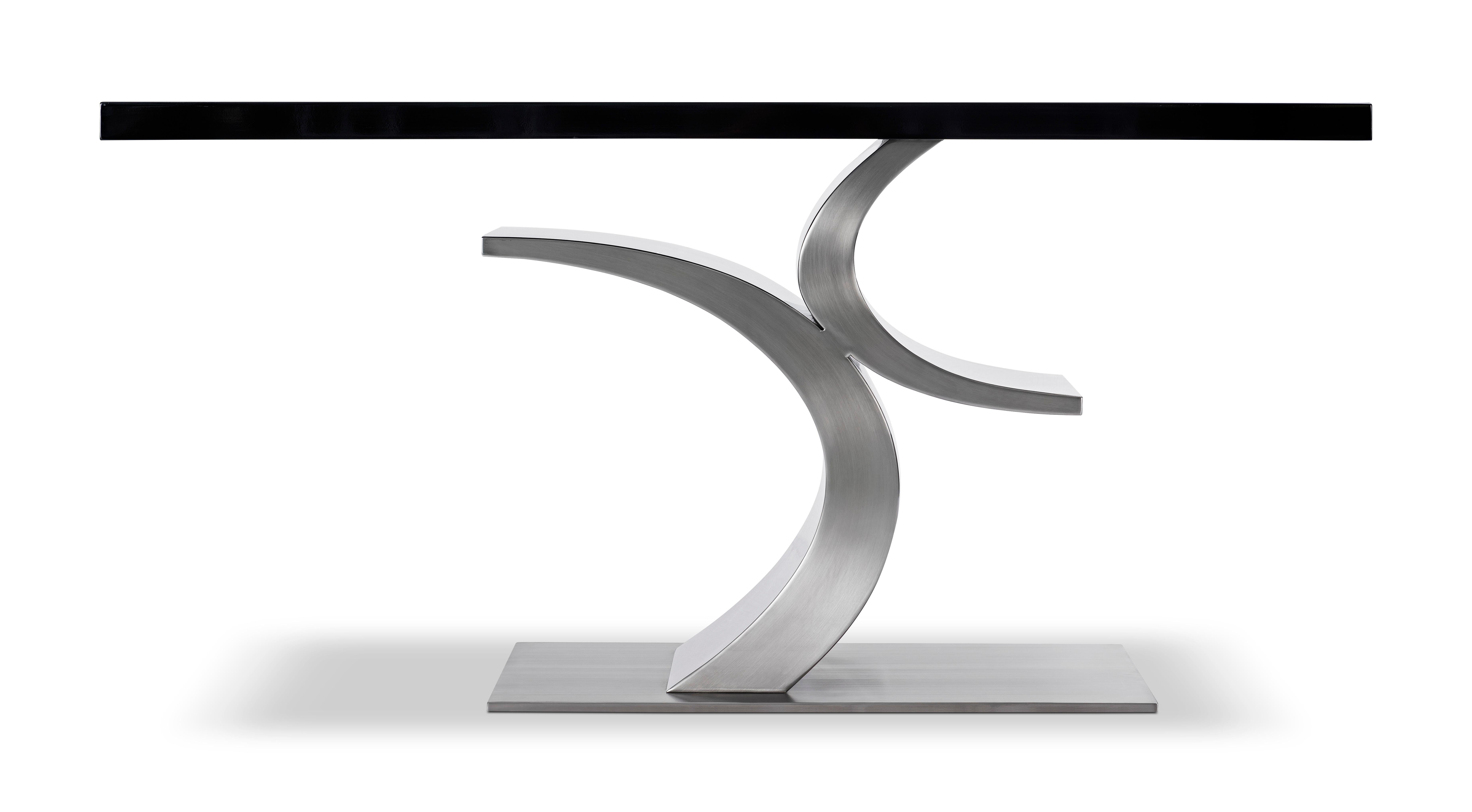 Modern Stainless Steel and black Lacquer console table designed by Greg Sheres.  This is our “Cosmopolitan” console table.  Polished stainless steel with satin stainless steel accents for the sculptural base. The table top is polished black lacquer.