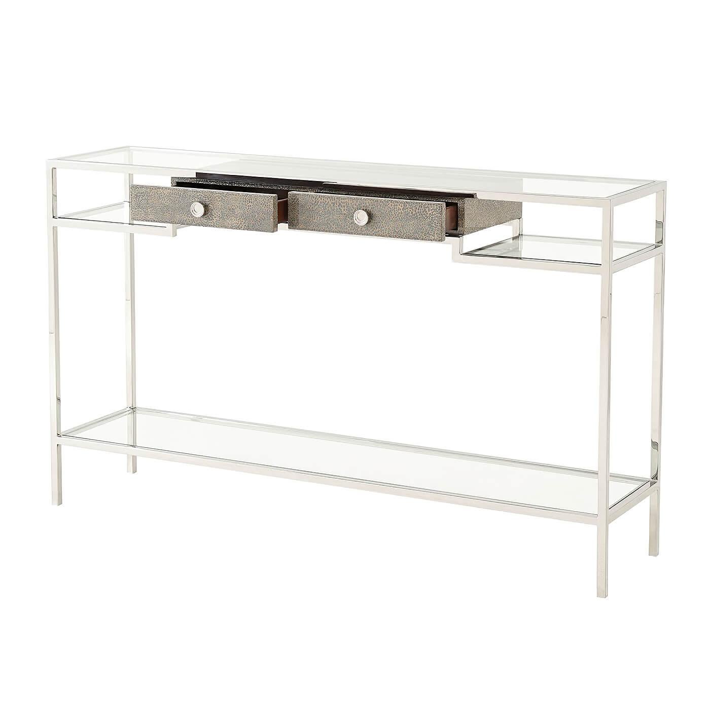 Modern console of grey-blue mottled eggshell stainless steel frame with tempered glass shelves and two frieze drawers 

Dimensions: 60