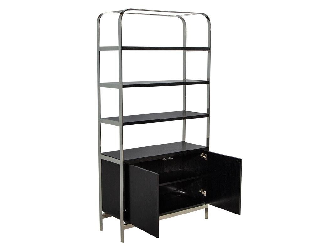 Modern stainless steel and oak bookcase étagère. Finished in a rich black lacquered satin finish. Perfect for an office study or living room.