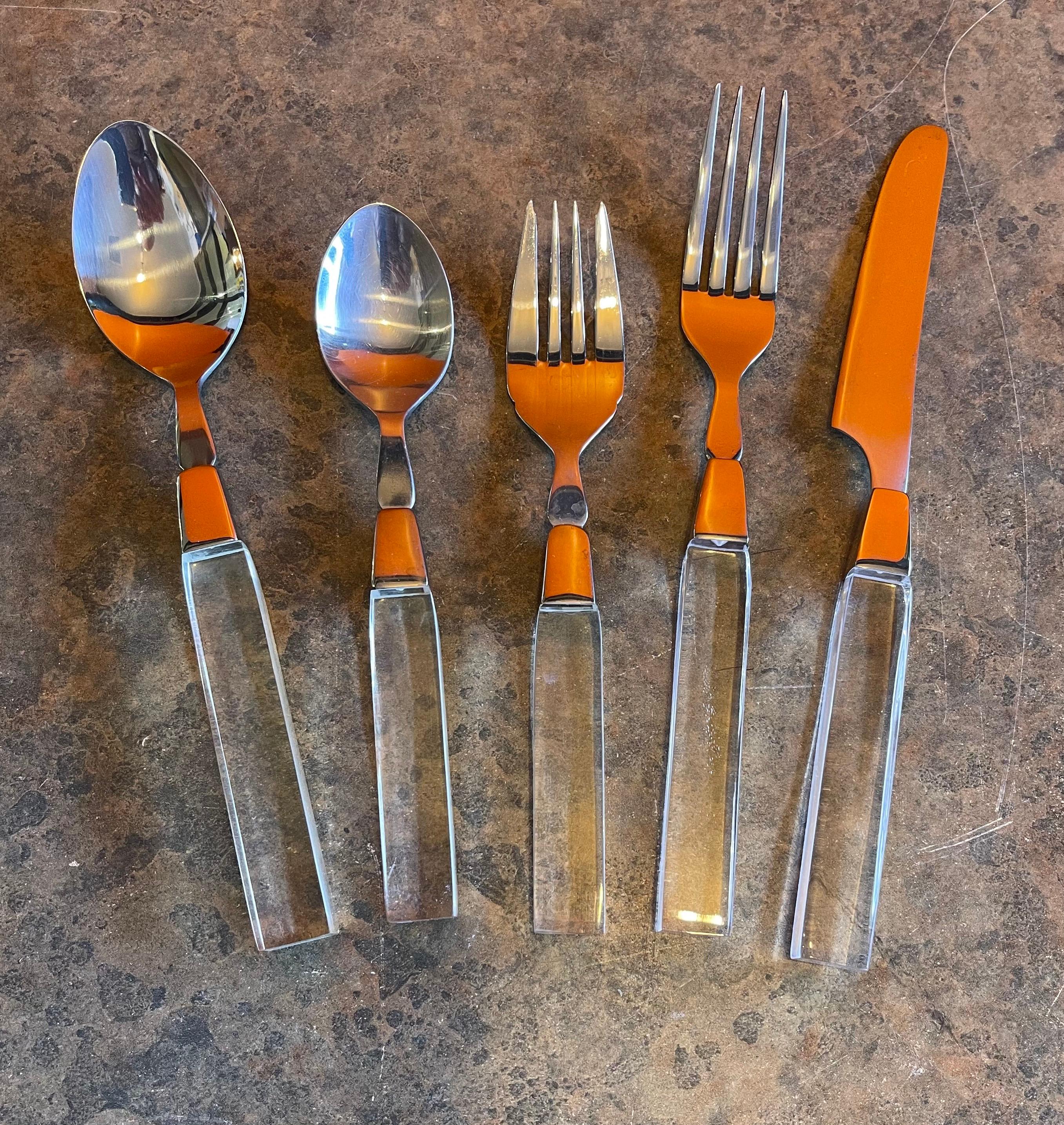 Modern stainless steel & lucite flatware set for eight (43 pieces total) by Rialto Lifetime Cutlery circa, 1980s. The set includes eight forks, salad forks, tea spoons, table spoons and knives as well as a butter knife and two small serving spoons.