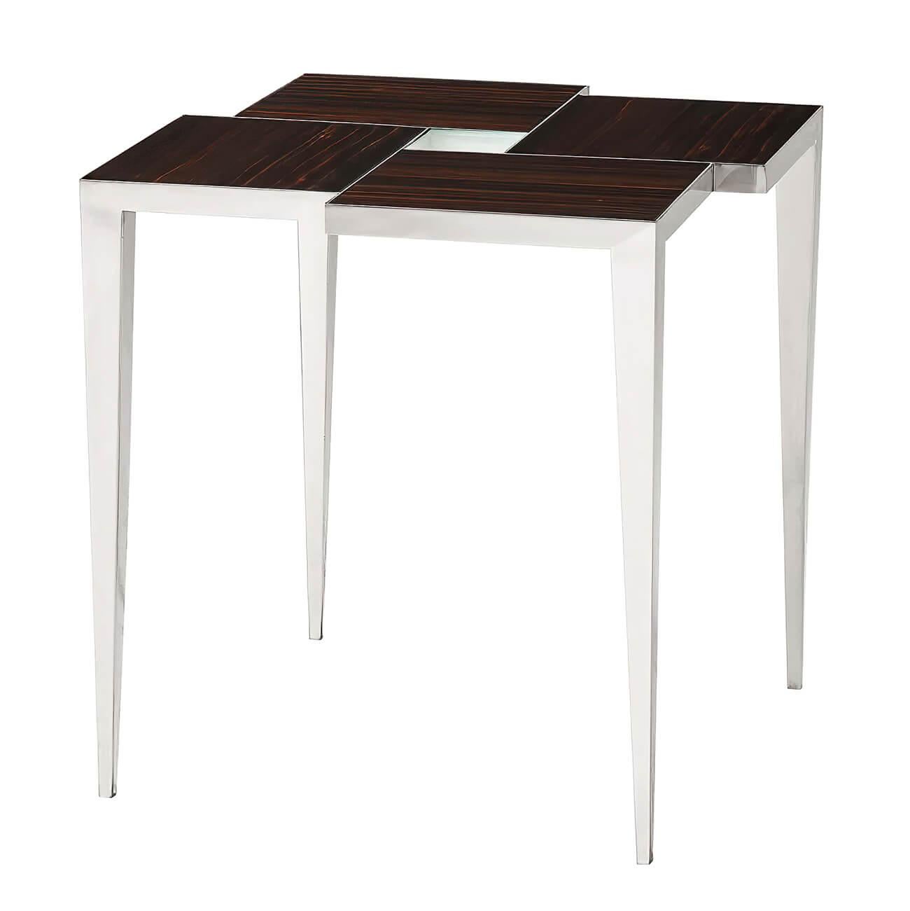 A modern stainless steel side table with offset Amara veneered top sections on a polished stainless steel base with square tapering legs.

Dimensions: 24