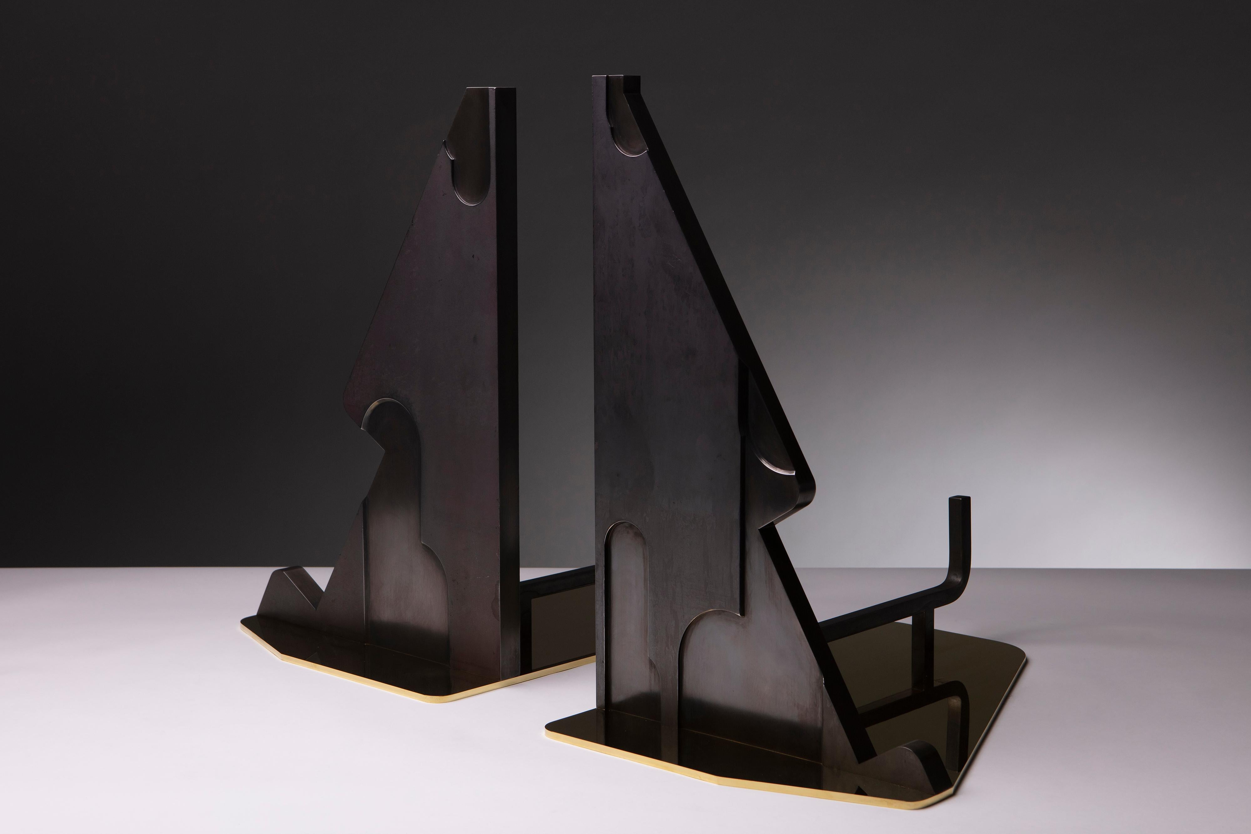 A unique pair of contemporary polished brass and steel andirons by Erik Johnson of APD. This stunning set makes a bold statement in the modern home.

1 of 1 

APD Item 00037

Letter of Authenticity included with set.

Dimensions:
Left 14 5/8