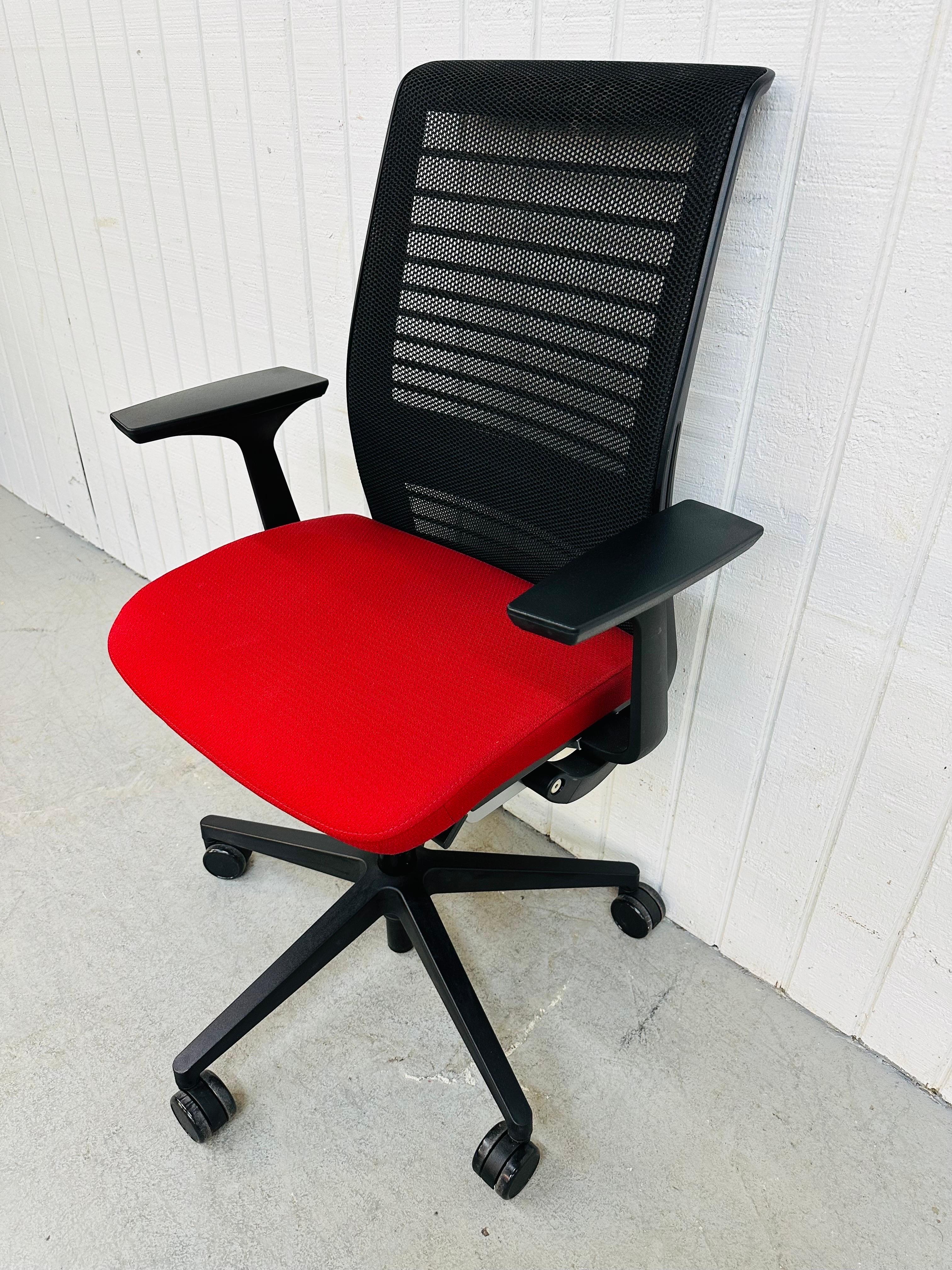 This listing is for a Modern Steelcase Office Chair. Featuring a sleek black modern designed frame, red upholstered adjustable swivel seat, and wheels for easy rolling. This is an exceptional combination of quality and design by Steelcase.