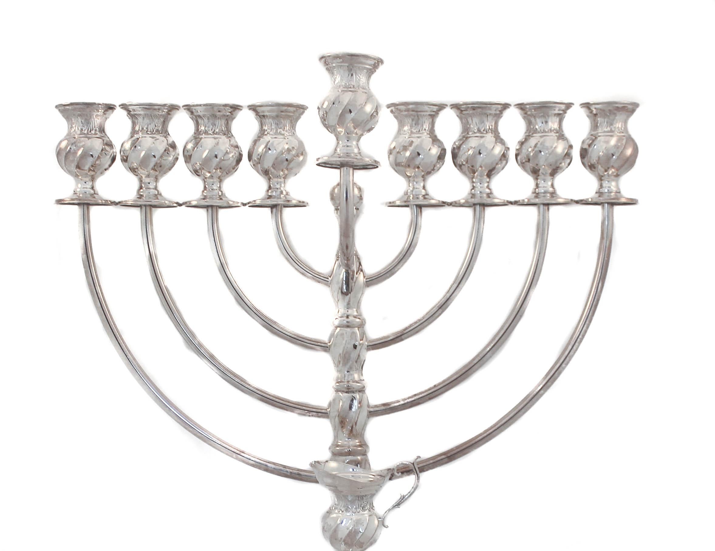 We are delighted to offer you this sterling silver modern menorah. With Hanukkah just a few weeks away, now is the time to treat yourself to a gorgeous new silver menorah. It has a sleek finish that is contemporary and very unusual. It has swirls