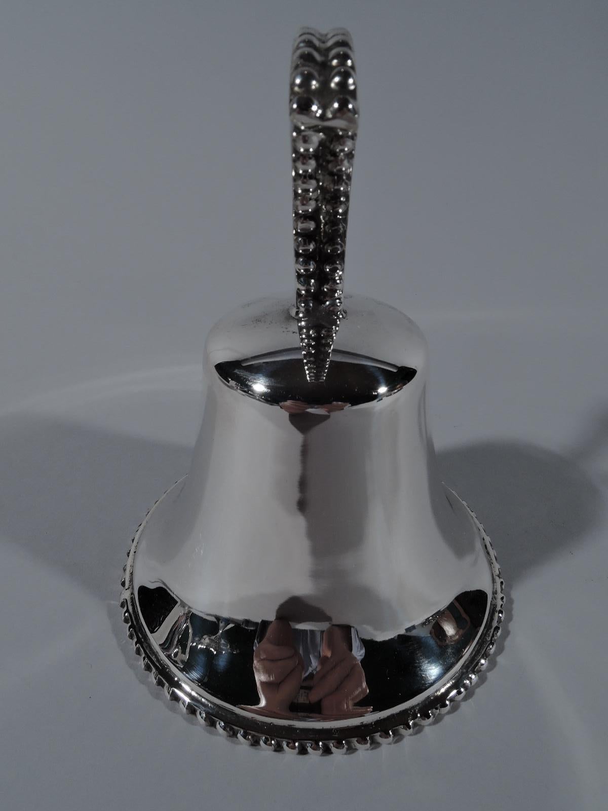 Modern sterling silver bell. Functional and melodious with open triangular handle and bold beading. Marked. Weight: 4.5 troy ounces. #BT195.