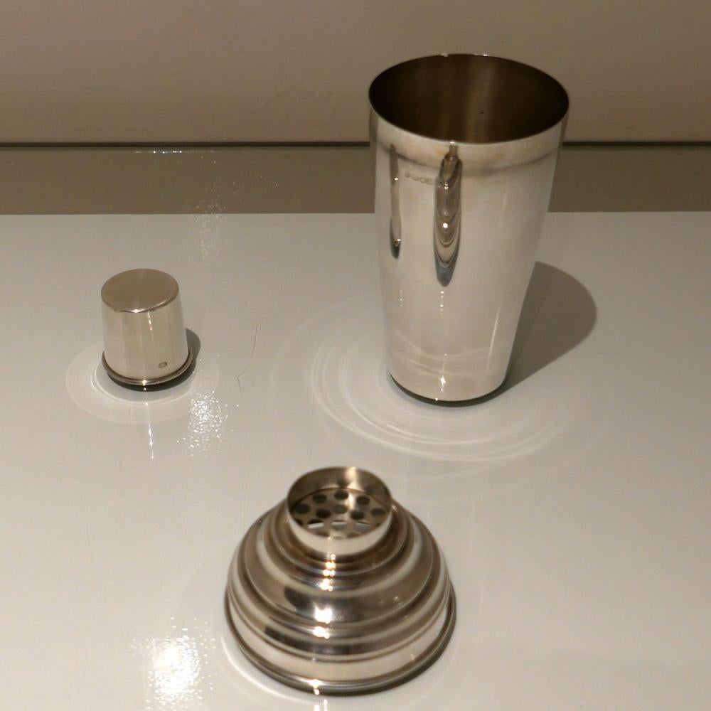 A stylish plain formed sterling silver cocktail shaker designed with an elegant tapering body (bowl) and detachable into three snuggly fitting sleeved sections.

 

Weight: 12.82 troy ounces/399 grams

Height: 9 inches/23cm

Diameter: 4