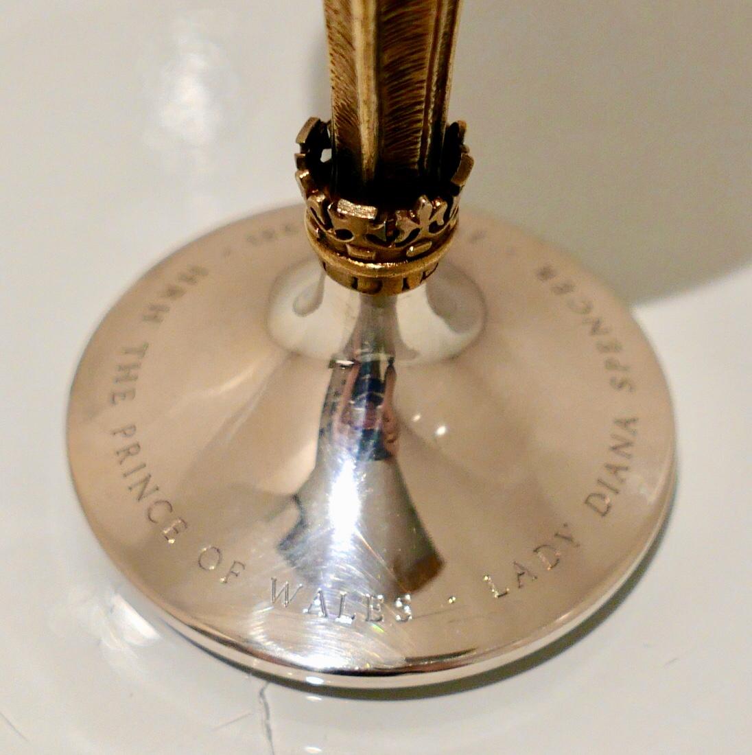 A stunning and highly collectable Stuart Devlin commemorative silver wine goblet designed with an unusual shaped bowl and stylish Prince of Wales feathers stem which is taken (copied) from the heraldic badge of the Prince of Wales.

Weight: 10.8