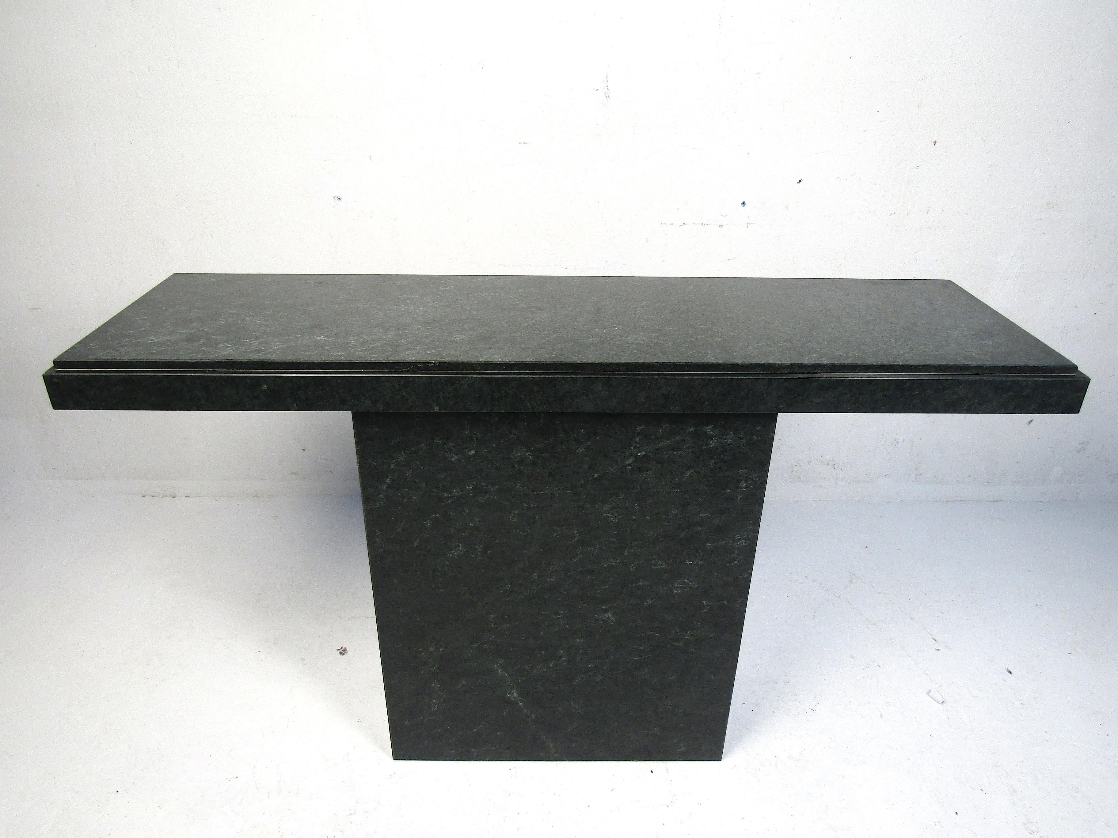 Simply stylish hall table made with a stone composite. Made to be tucked up against a wall, one side is open. Please confirm item location with dealer (NJ or NY).