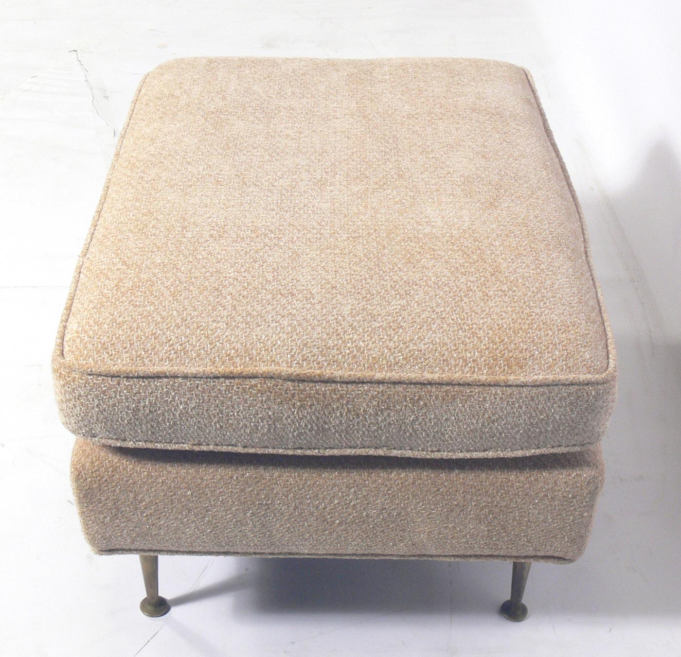 Modern stool or bench, attributed to T.H. Robsjohn-Gibbings, American, circa 1950s. This piece is currently being reupholstered and can be completed in your fabric at no additional charge. Simply send us three yards of your fabric after the purchase.