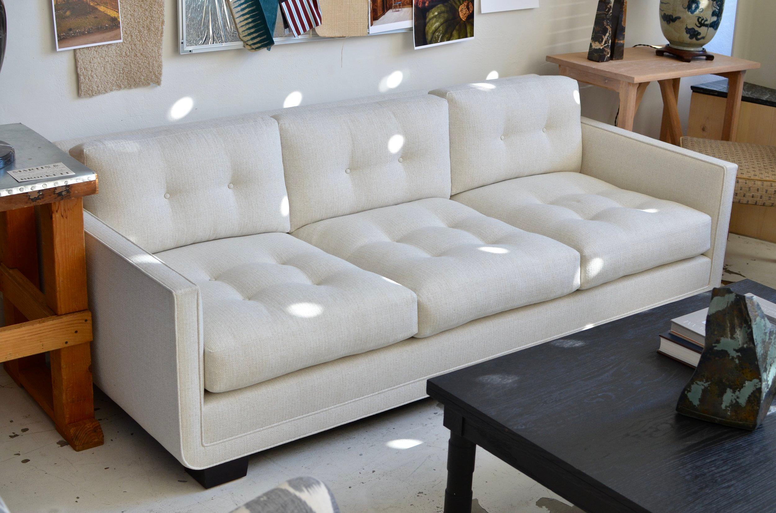 American Modern Streamlined Tufted Sofa with Curved Frame Detail by Martin & Brockett For Sale