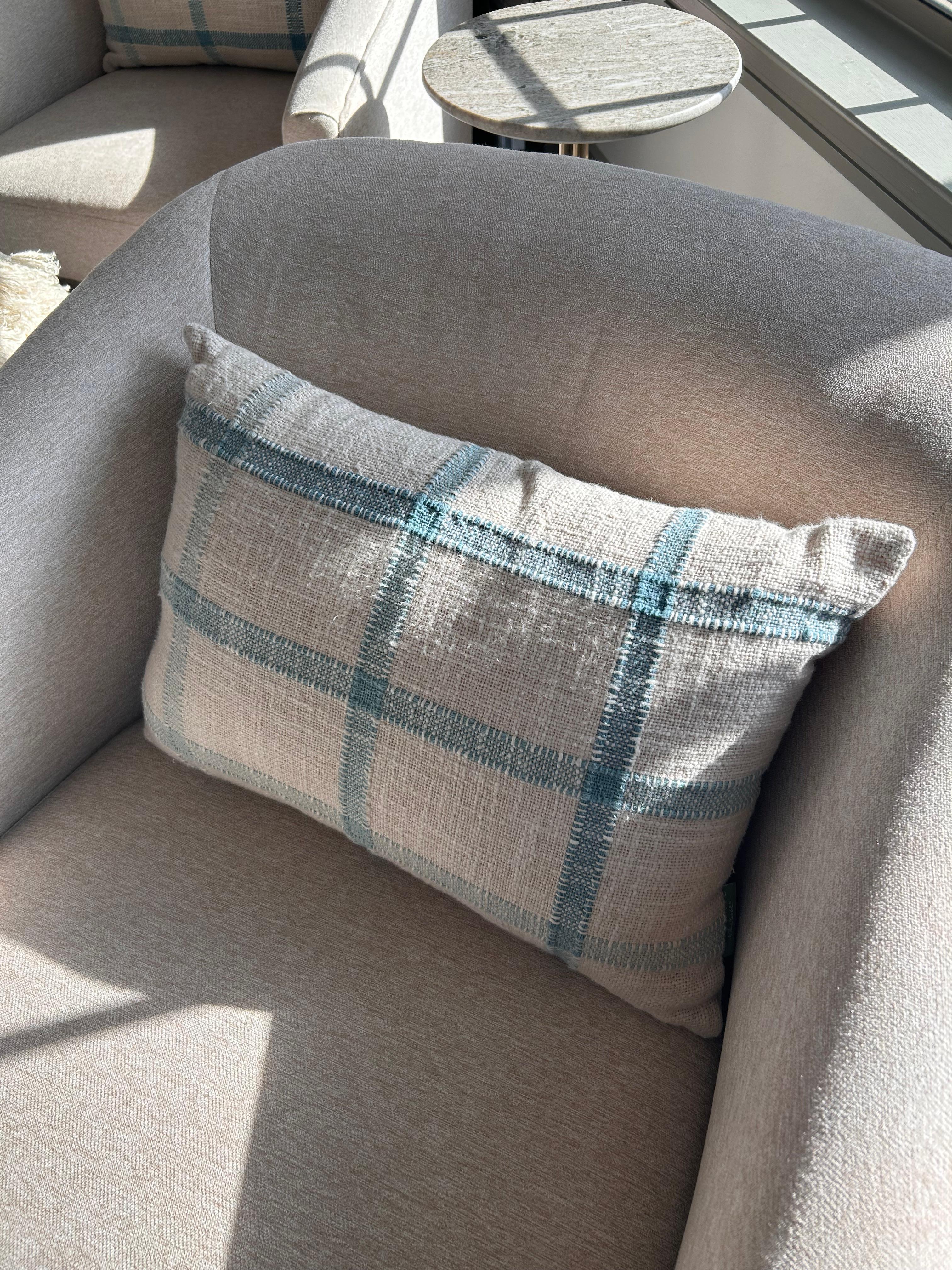 Classic blue stripe pattern against a soft cream backdrop. 
Perfect for layering on a sofa, armchair, or bed , a subtle yet striking addition to traditional, transitional, or modern interiors. 
---
Kemble has a distinctive style that blends