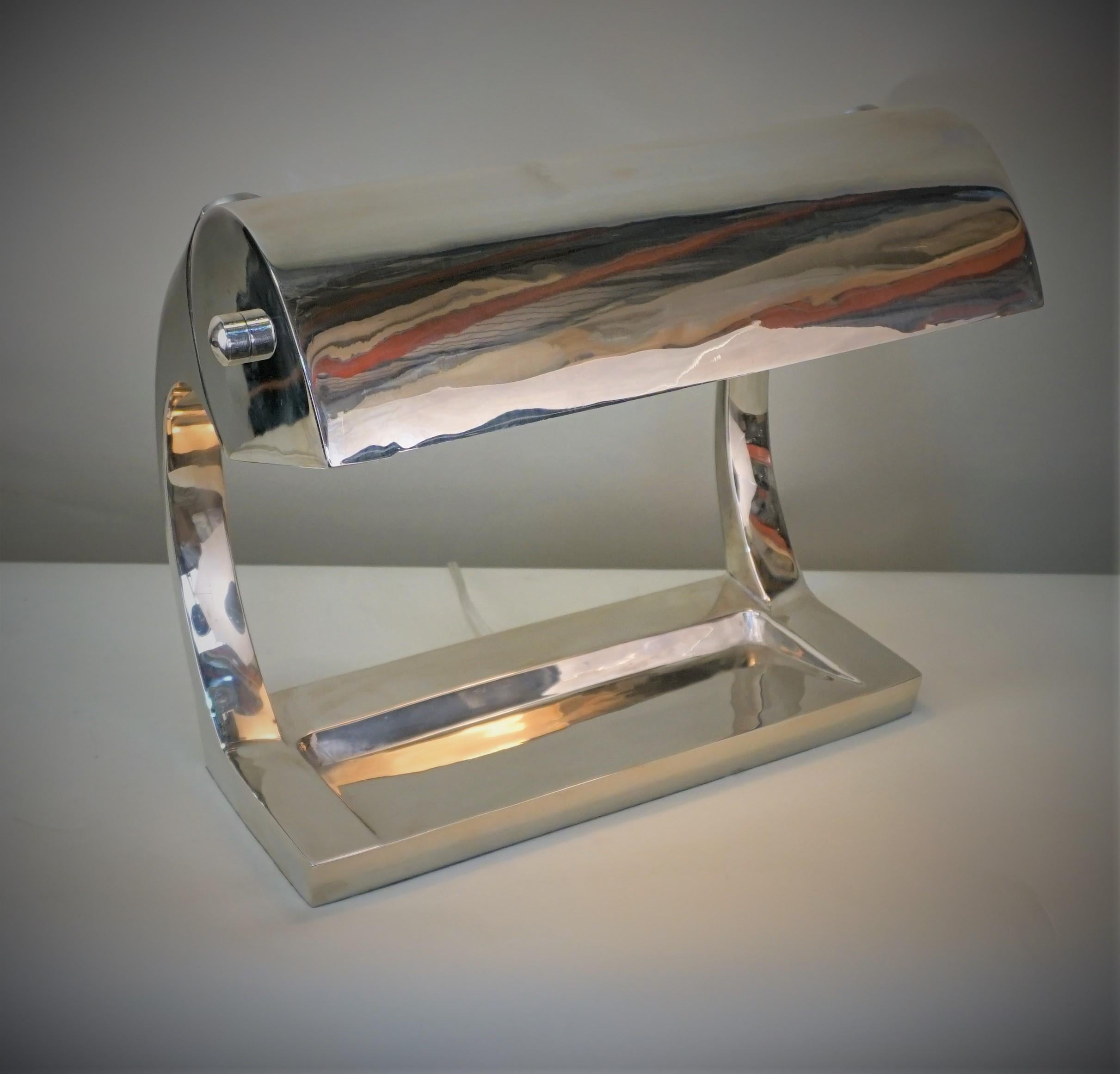 Very clean line nickel on bronze desk lamp with double light for maximum lamination.