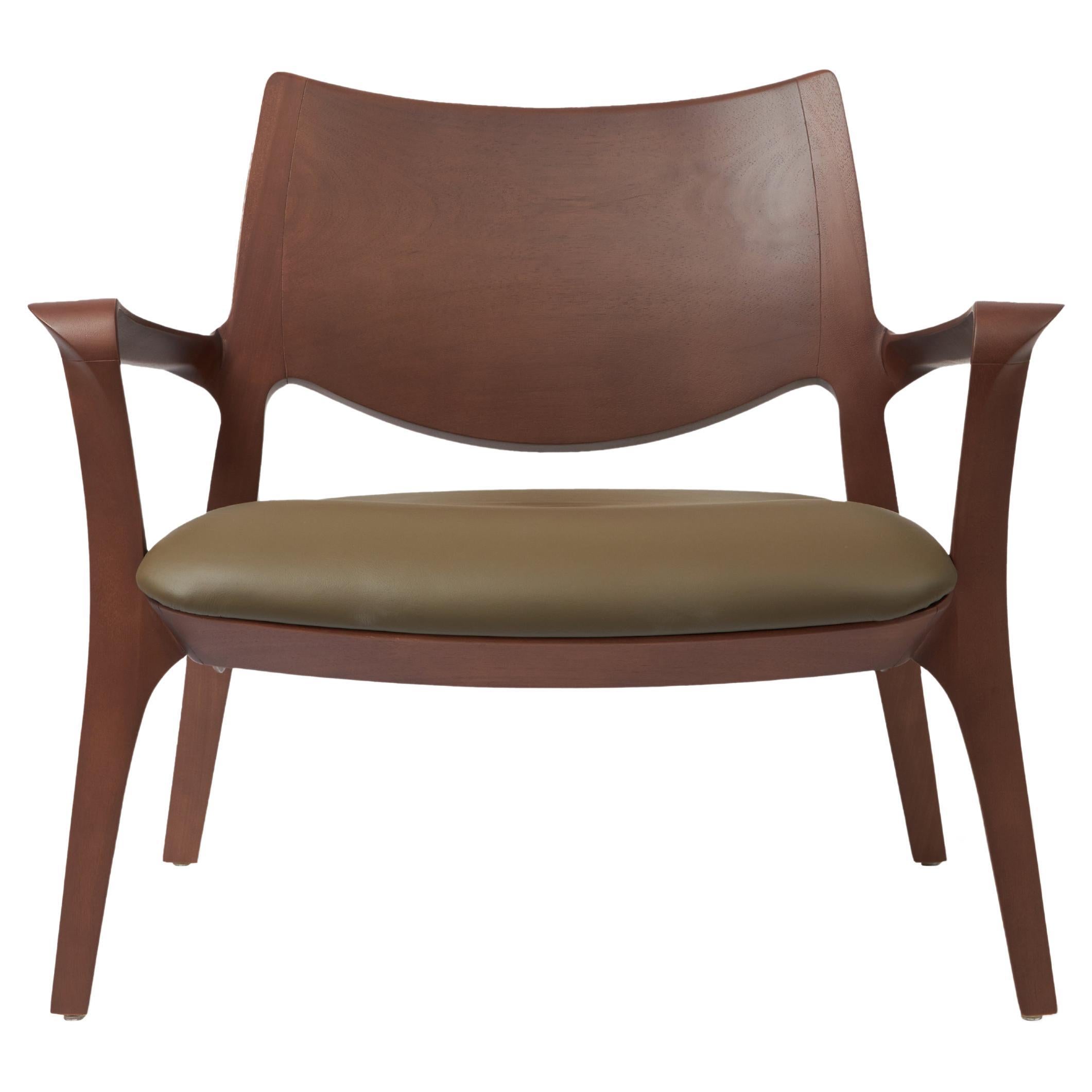 Modern Style Aurora armchair Sculpted in solid walnut finish, leather seating  For Sale