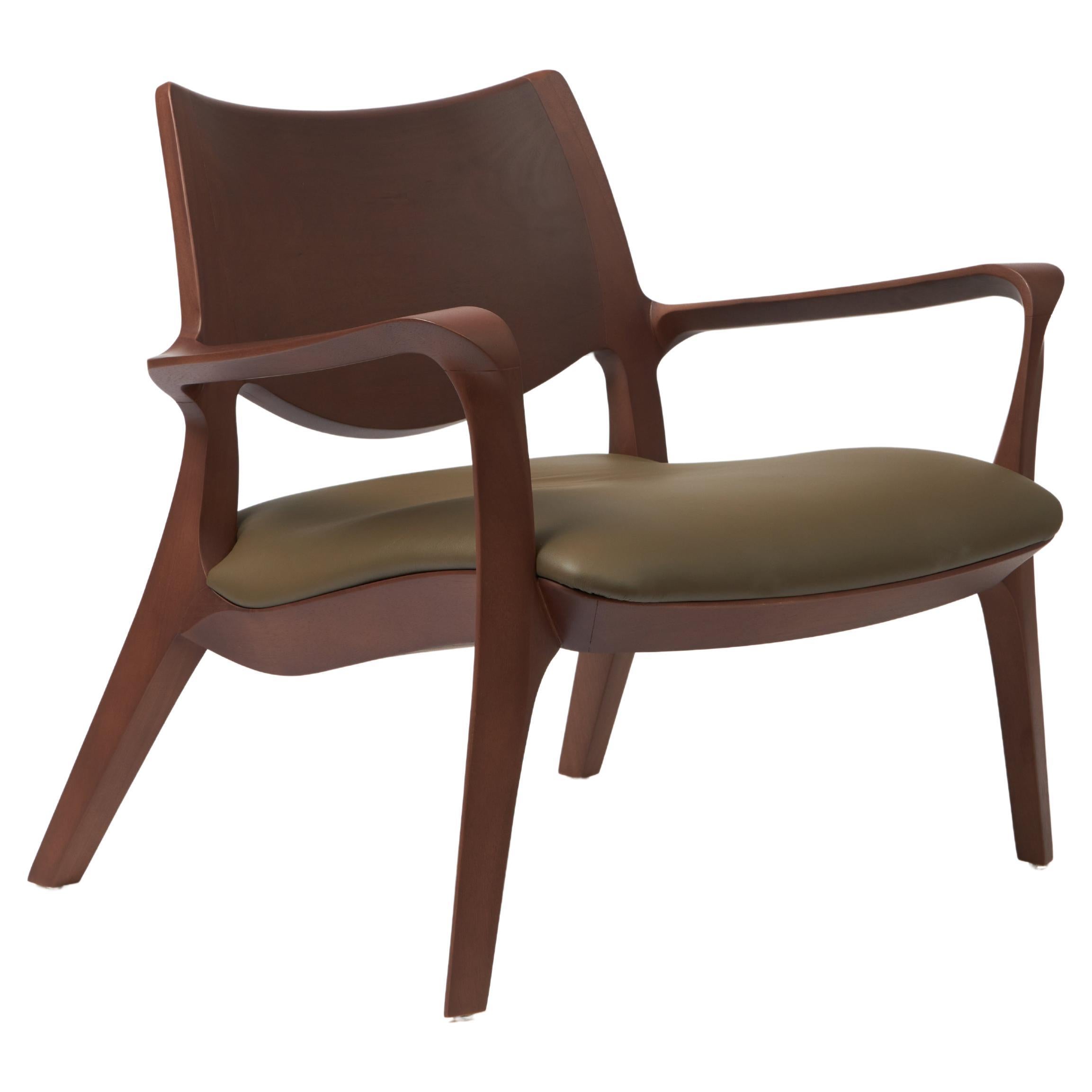 Modern Style Aurora armchair Sculpted in solid walnut finish, leather seating  For Sale