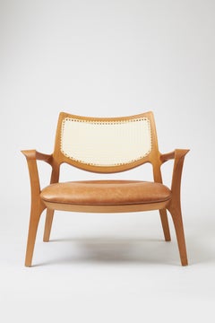 Aurora-Sessel im modernen Stil, geformt aus Massivholz, Rückenlehne mit Rohrgestell, Ledersitz