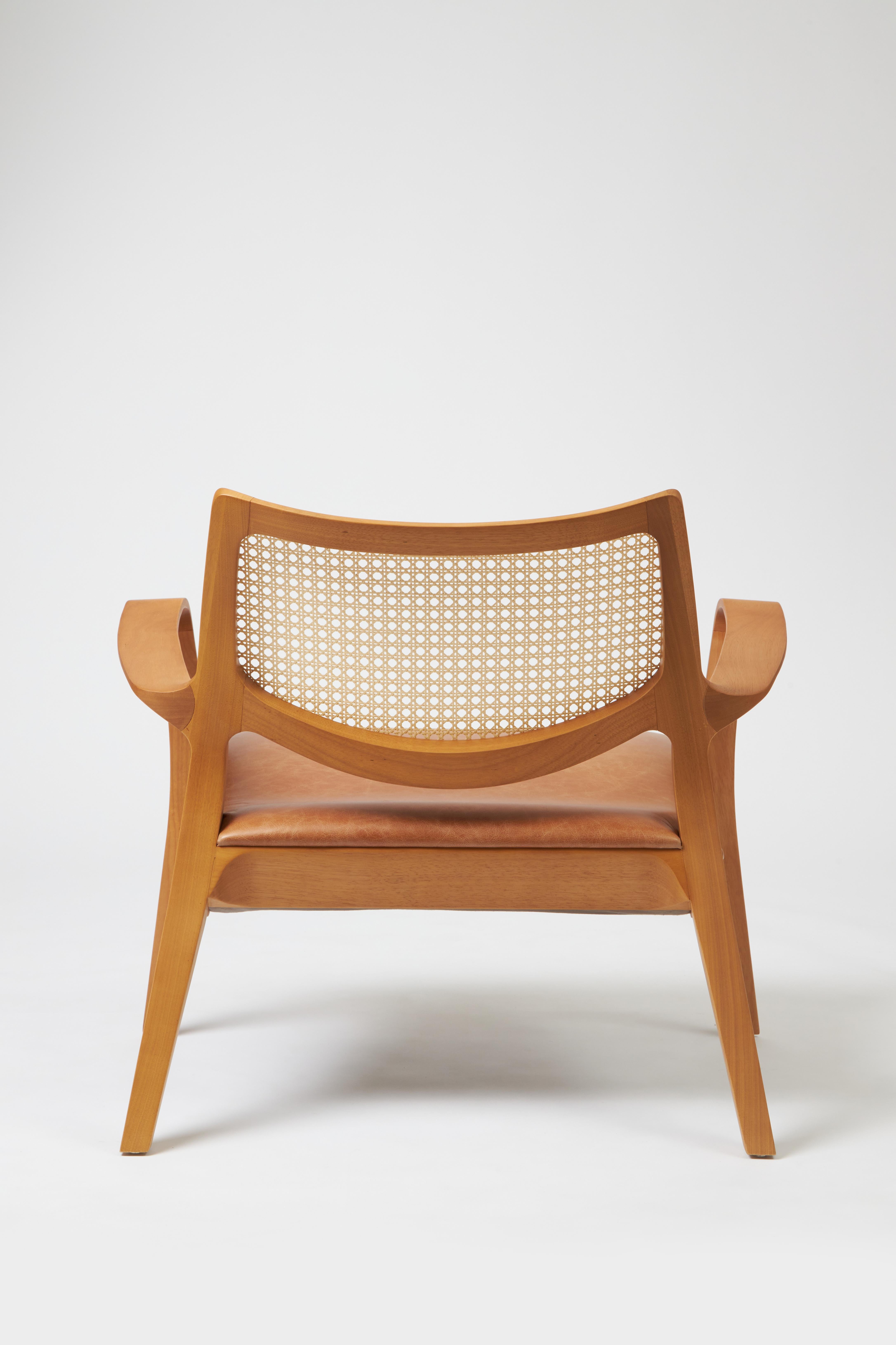 Caning Modern Style Aurora armchair Sculpted in solid wood, caning back, leather seat For Sale